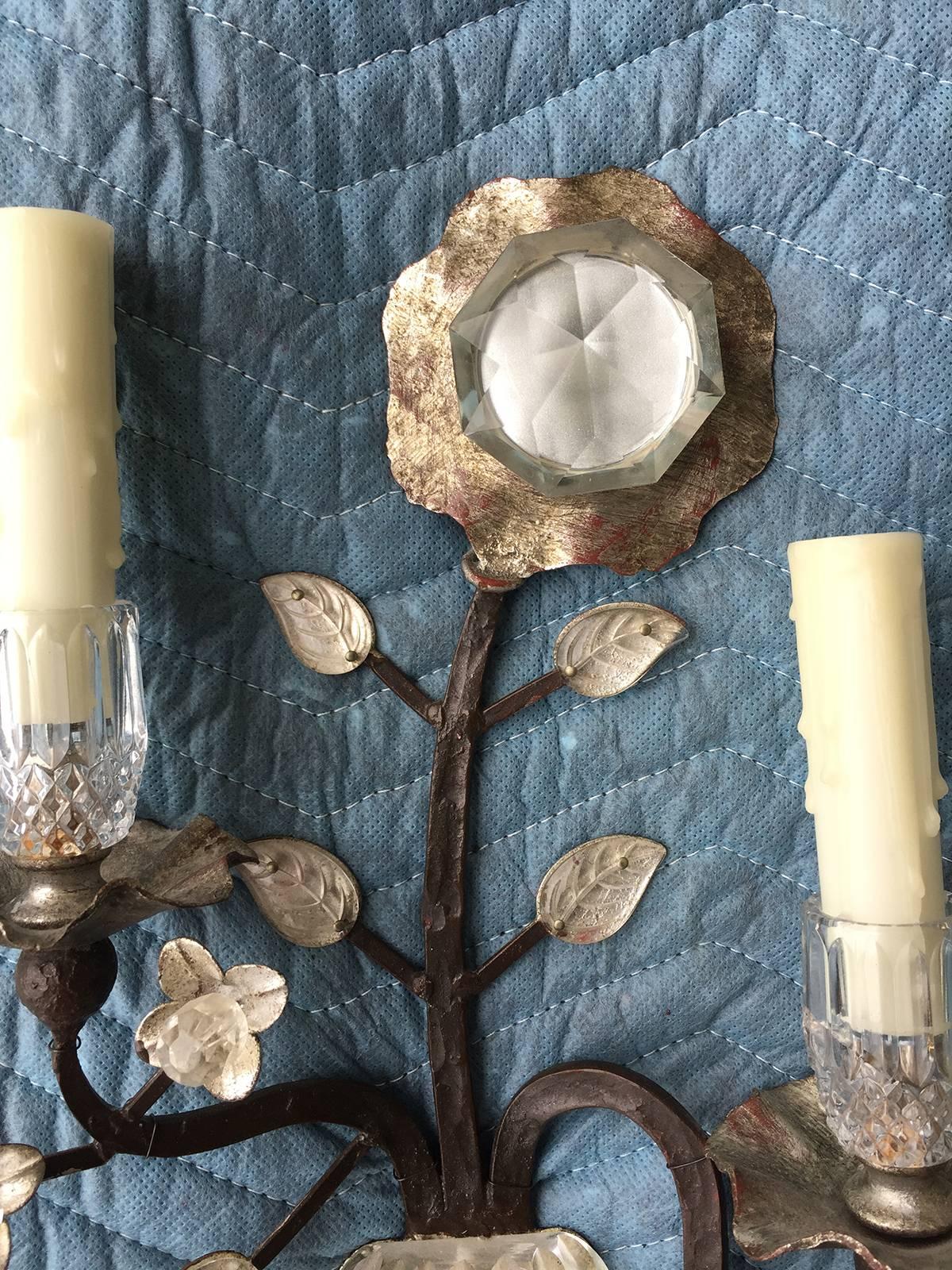 Pair of Bagues iron sconces with crystal.