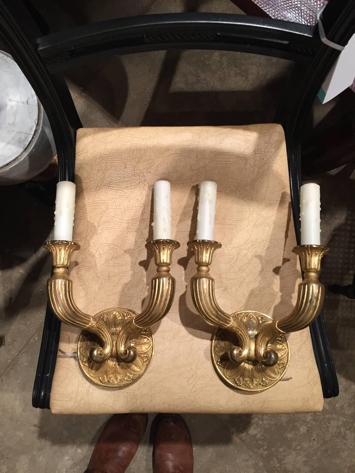 Pair of 19th-20th century French fire gilded bronze Empire style two-arm sconces.