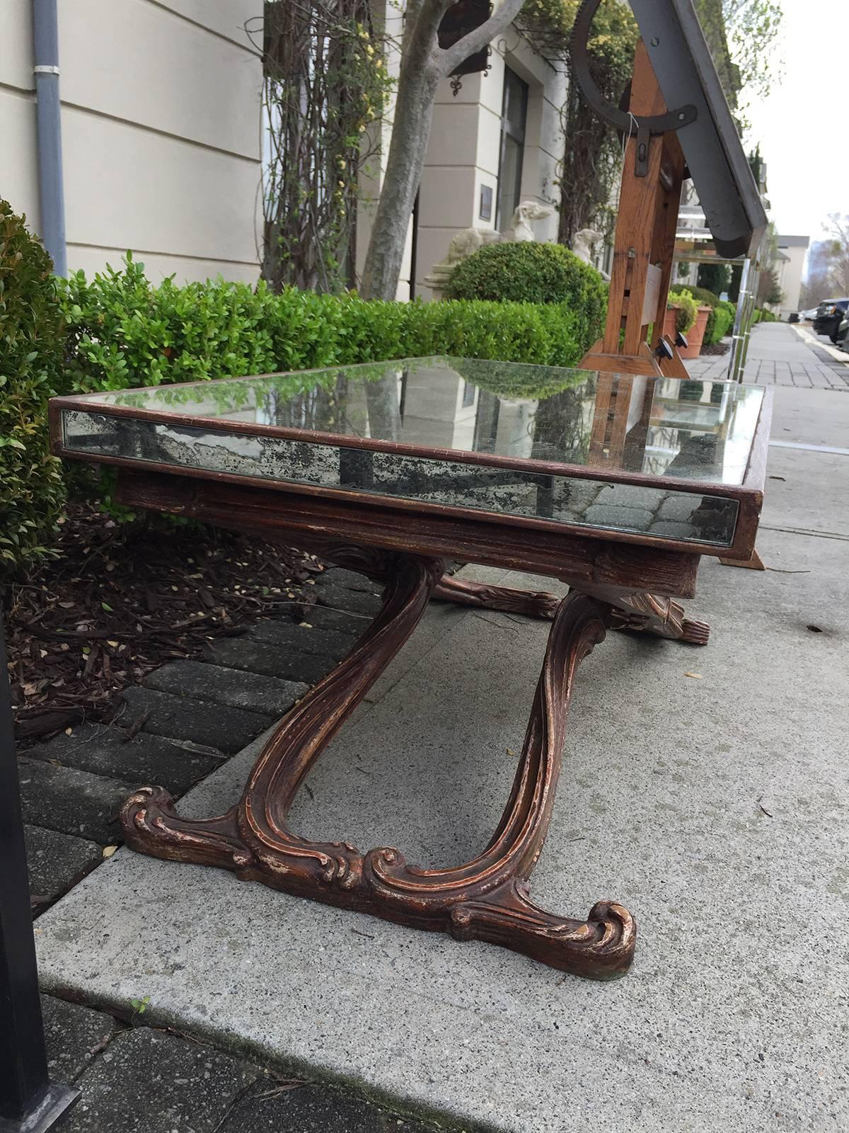 Early to Mid-20th Century Italian mirrored coffee table in the style of Jansen.