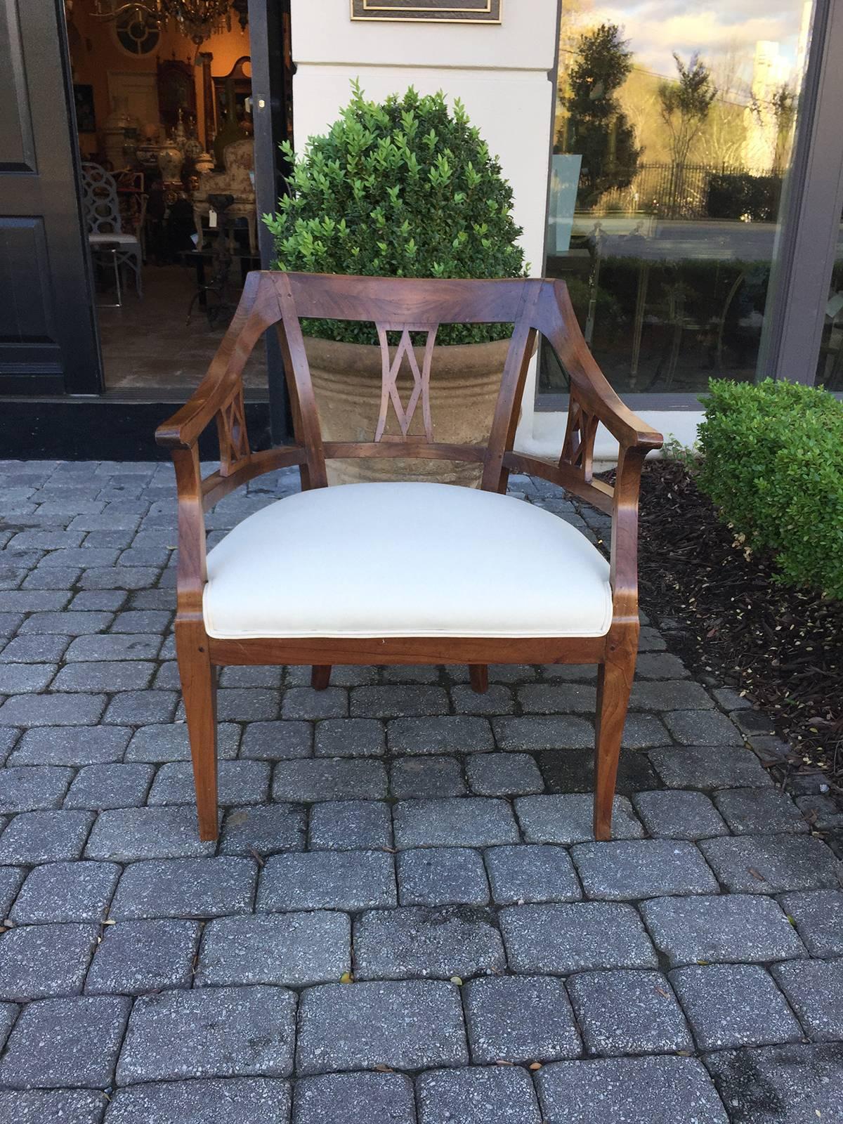 19th century Biedermeier fruitwood open armchair.