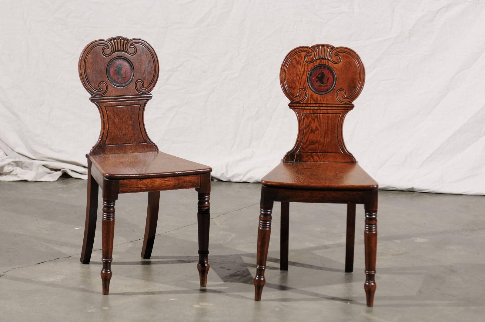 English set of four hall chairs, oak with crest, circa 1830.