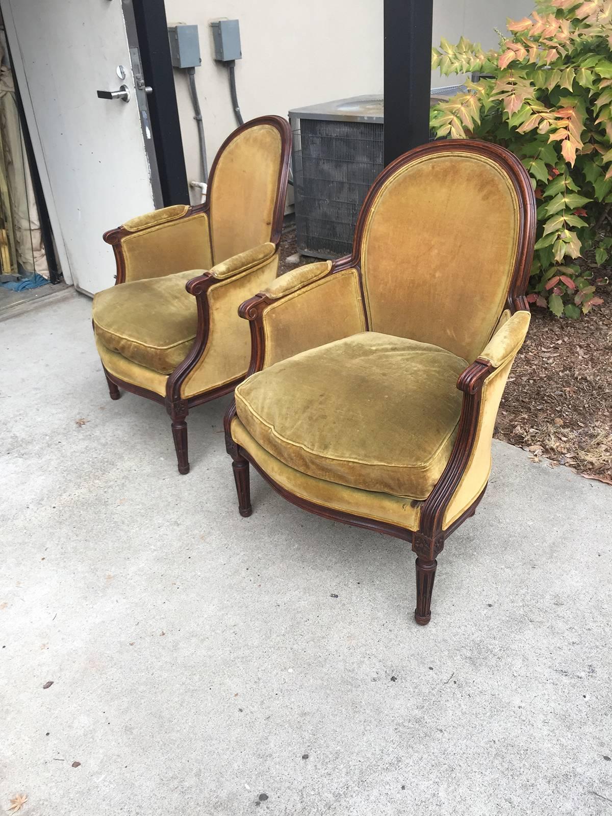 19th century French pair of Directoire style carved chairs with green velvet.