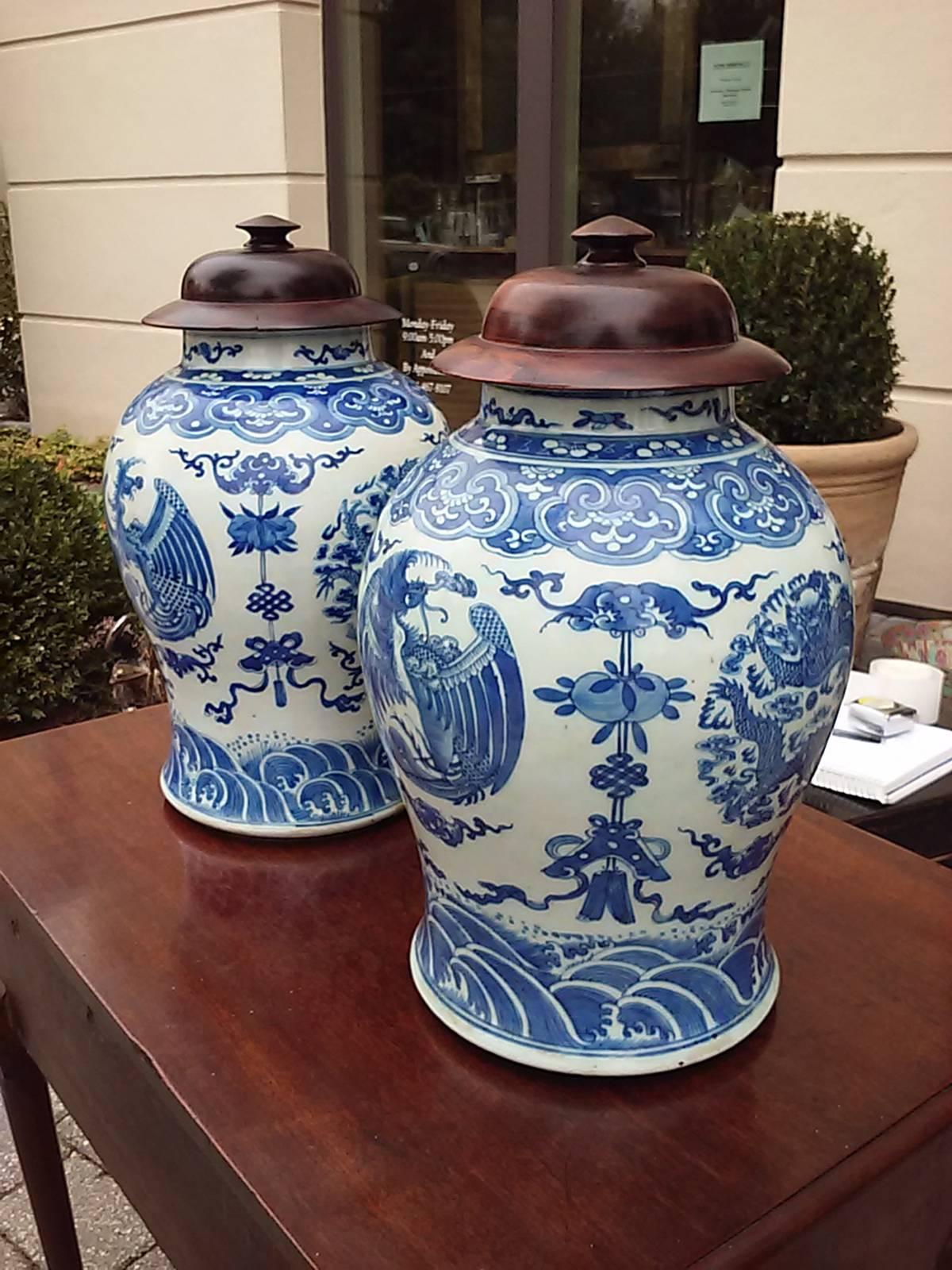 Probably 19th century pair of covered blue and white jars.