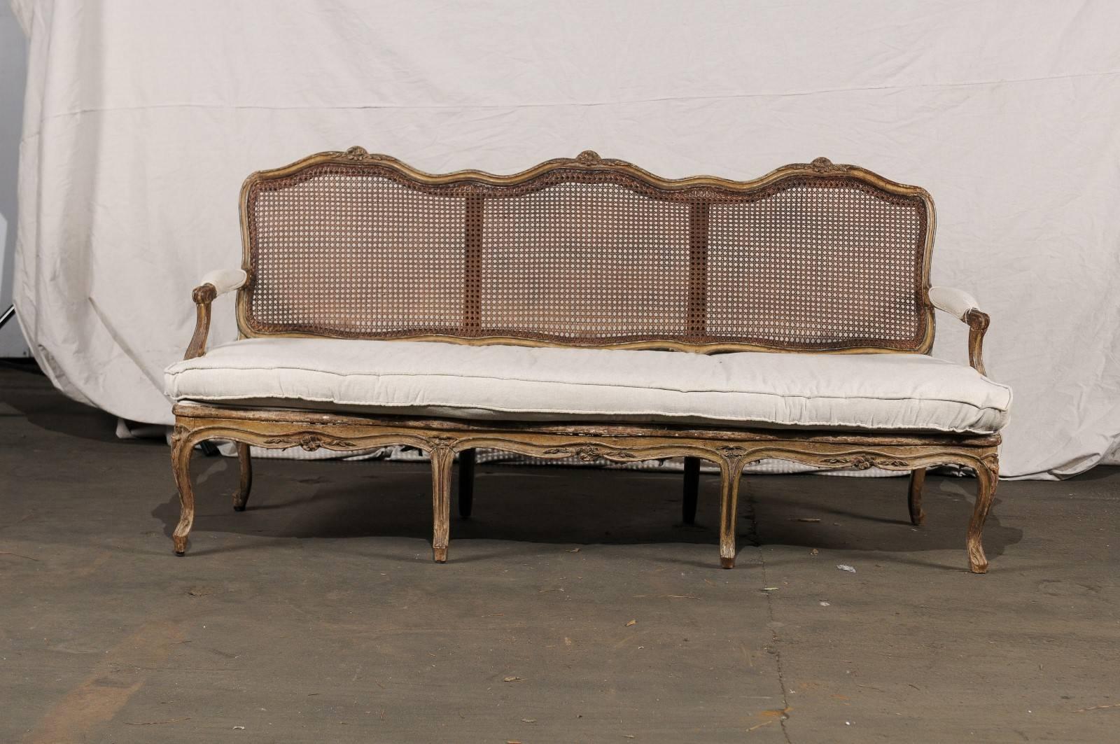 18th-19th century Regence settee with cane.