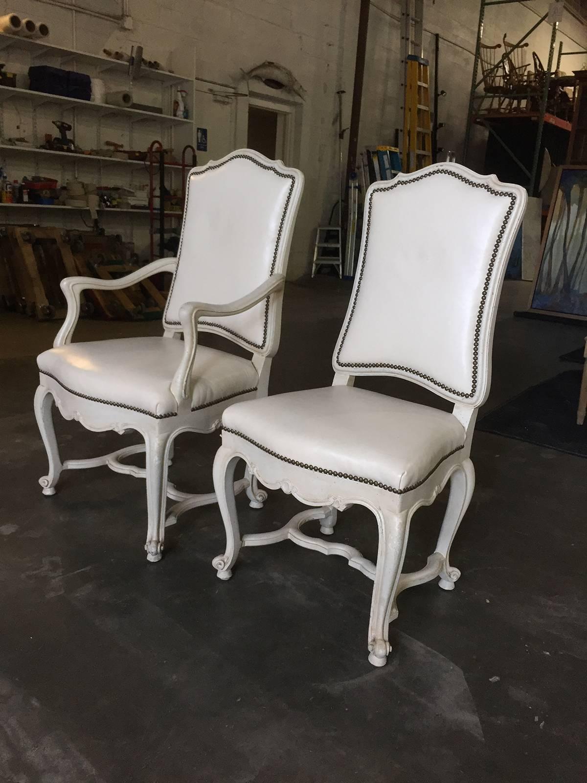 Set of eight 20th century white leather dining chairs, in the style of Don Rousseau.
