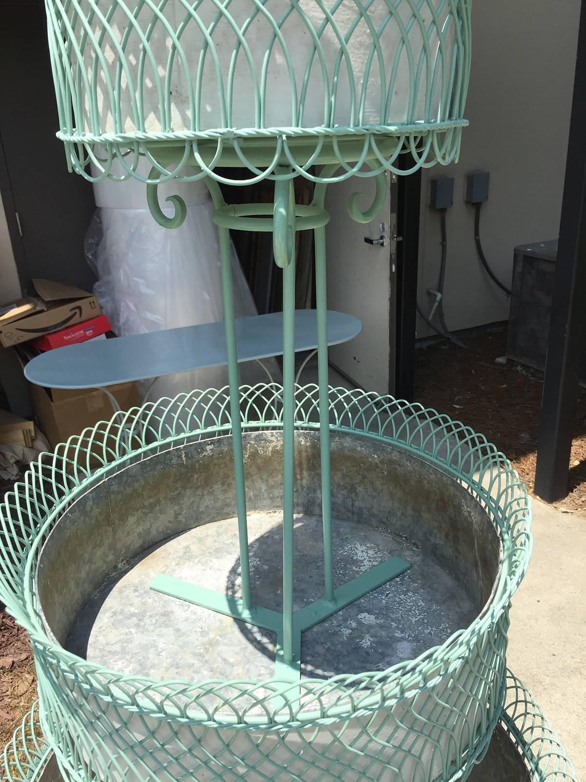 Probably French, circa 1900, an exceptional scaled three-tier wire planter, Sandleblasted and Painted, with old tole liners-(top: 14"diam, middle: 20.25"diam) Overall dimensions-26.5" diam x 72" T.