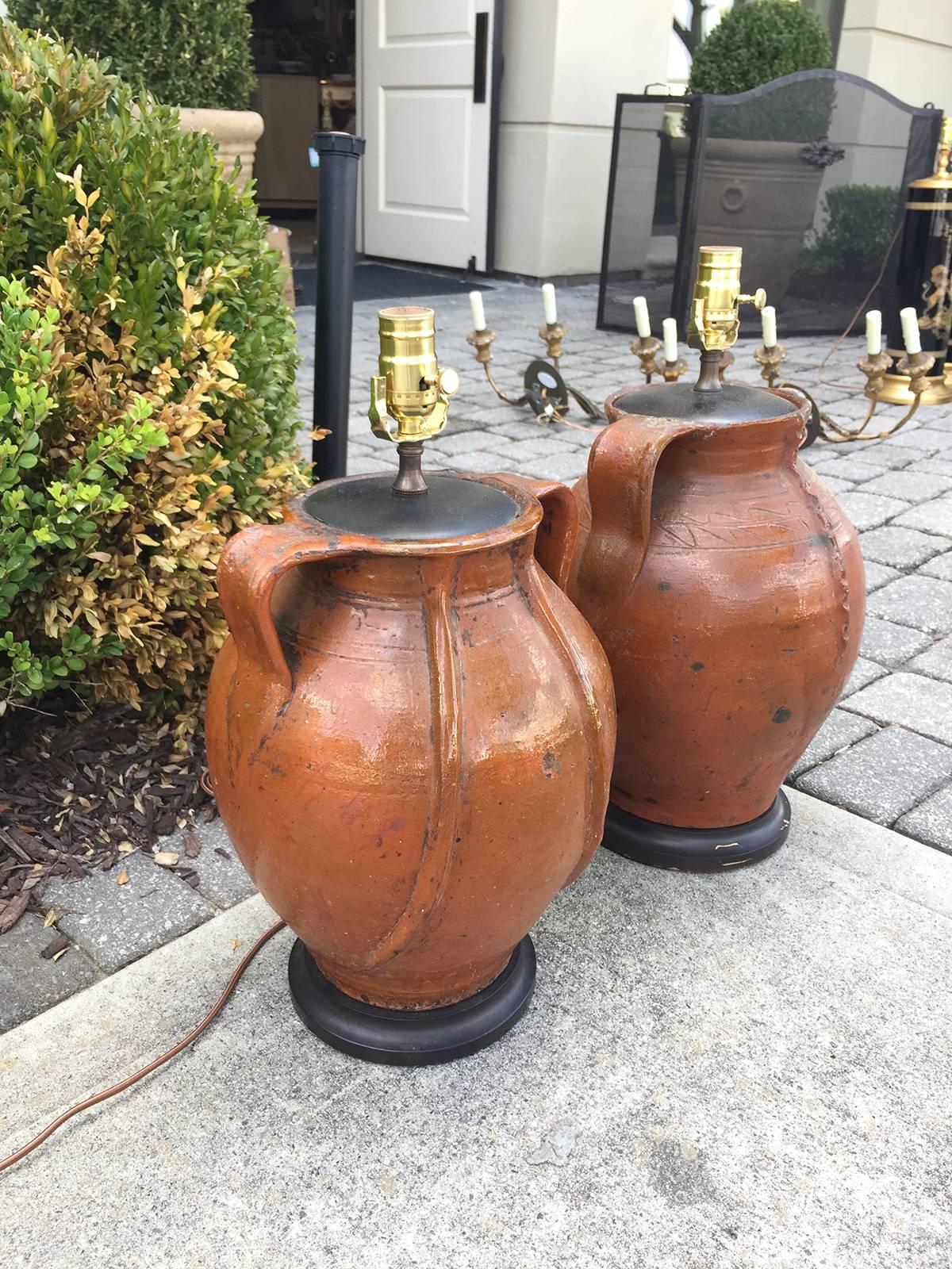19th-20th century two similar French pottery urns as lamps.