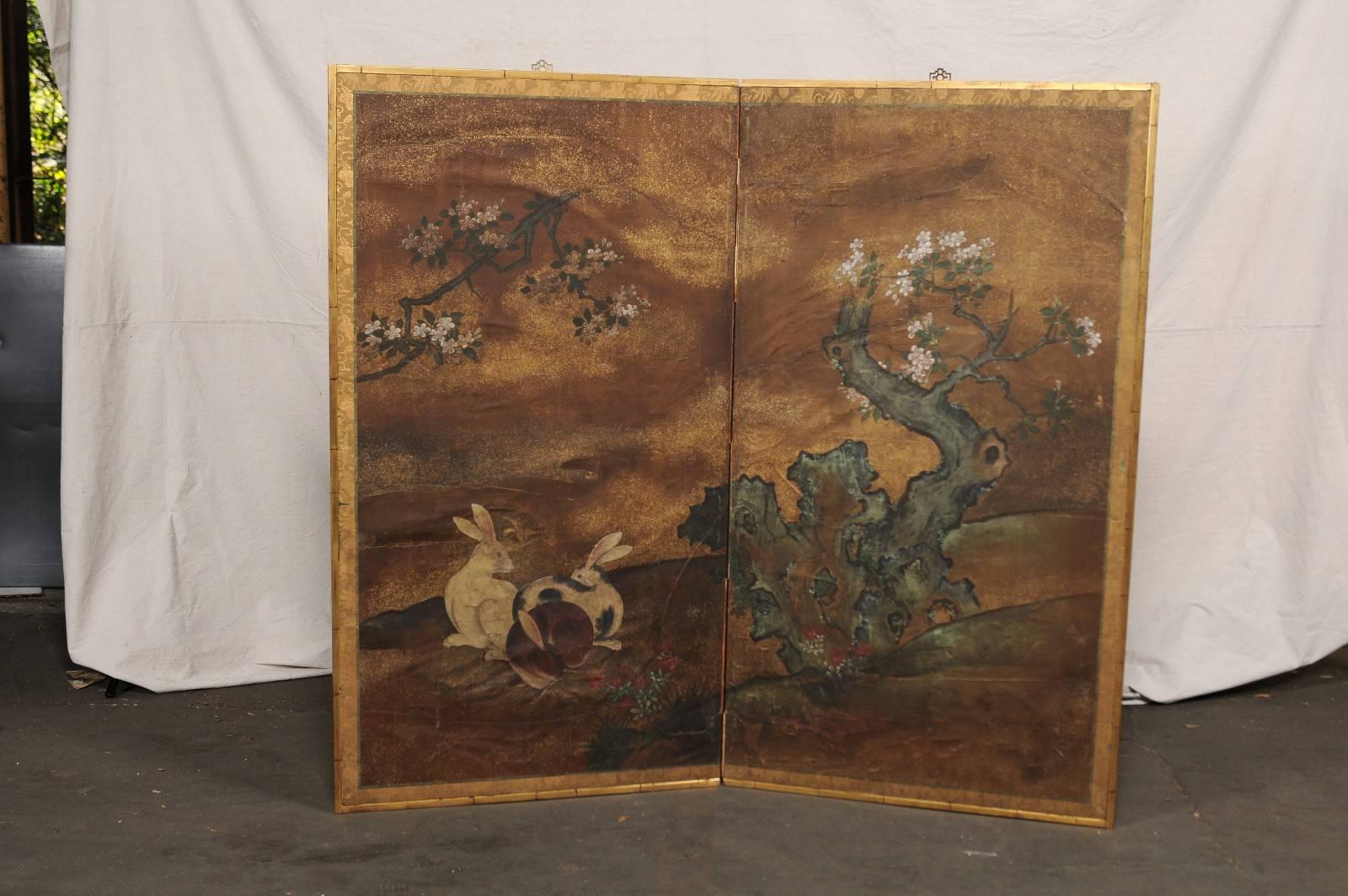 18th-19th century Japanese two-panel paper screen with rabbits.