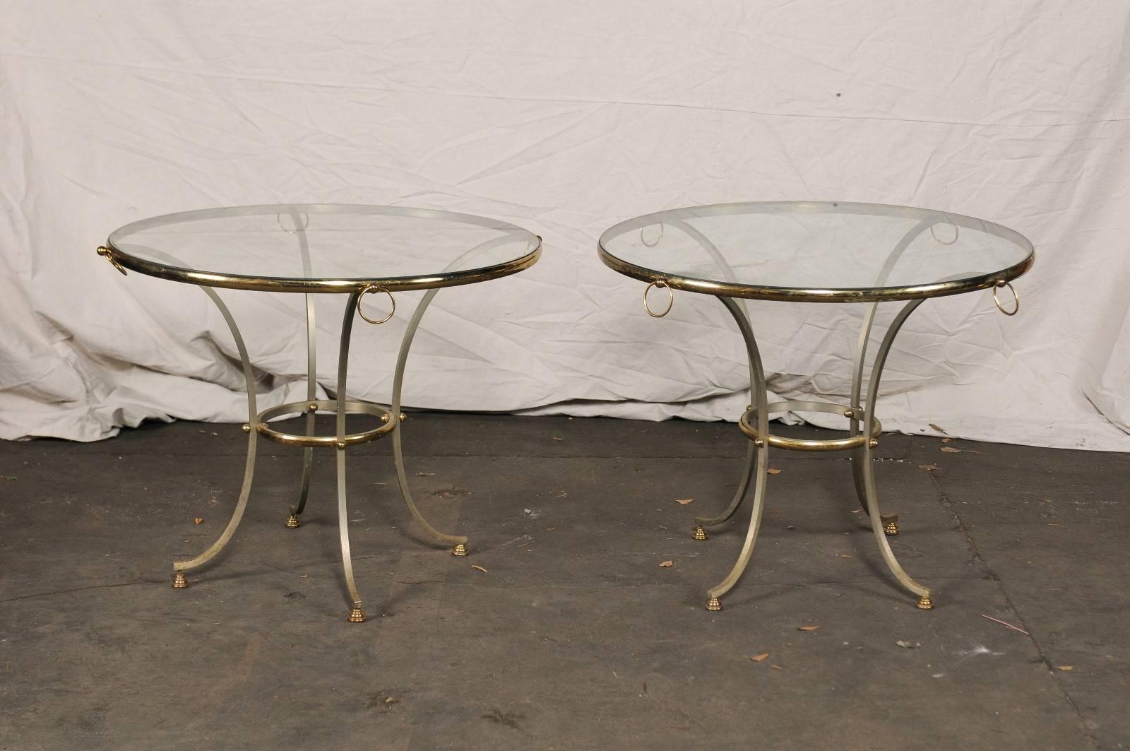 Pair of large-scale 20th century steel and brass gueridons in the style of Jansen.