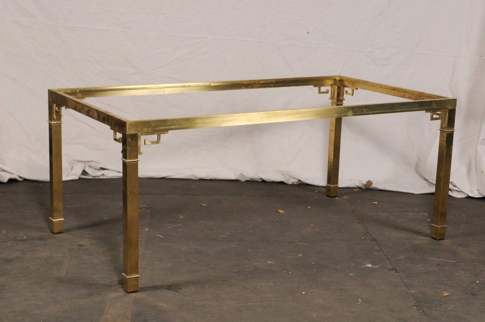 Italian brass dining table in the style of Mastercraft, Greek key motif, Classic modern timeless, does not include glass, circa 1970s.