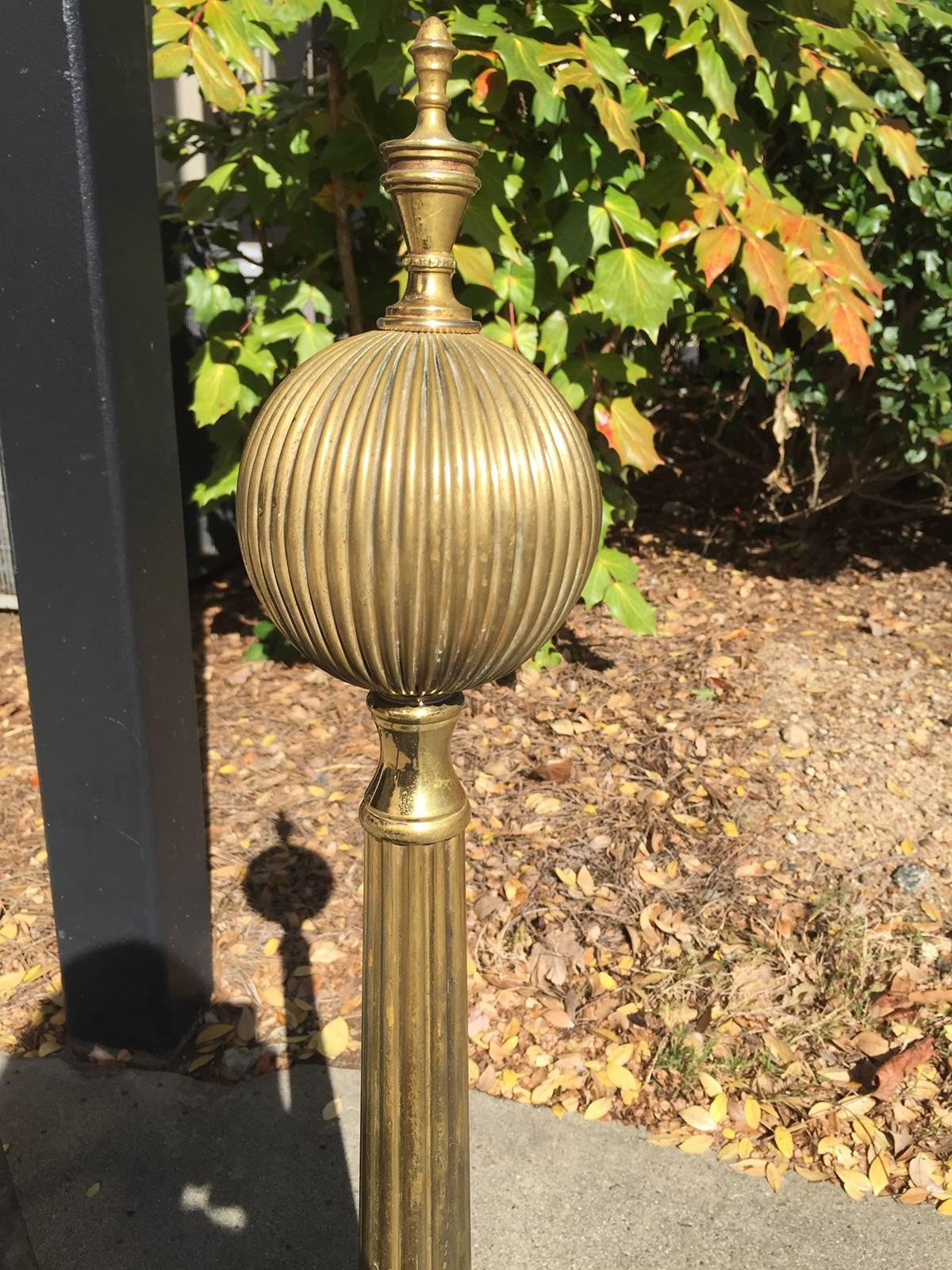 20th century tall brass andirons with melon finial.