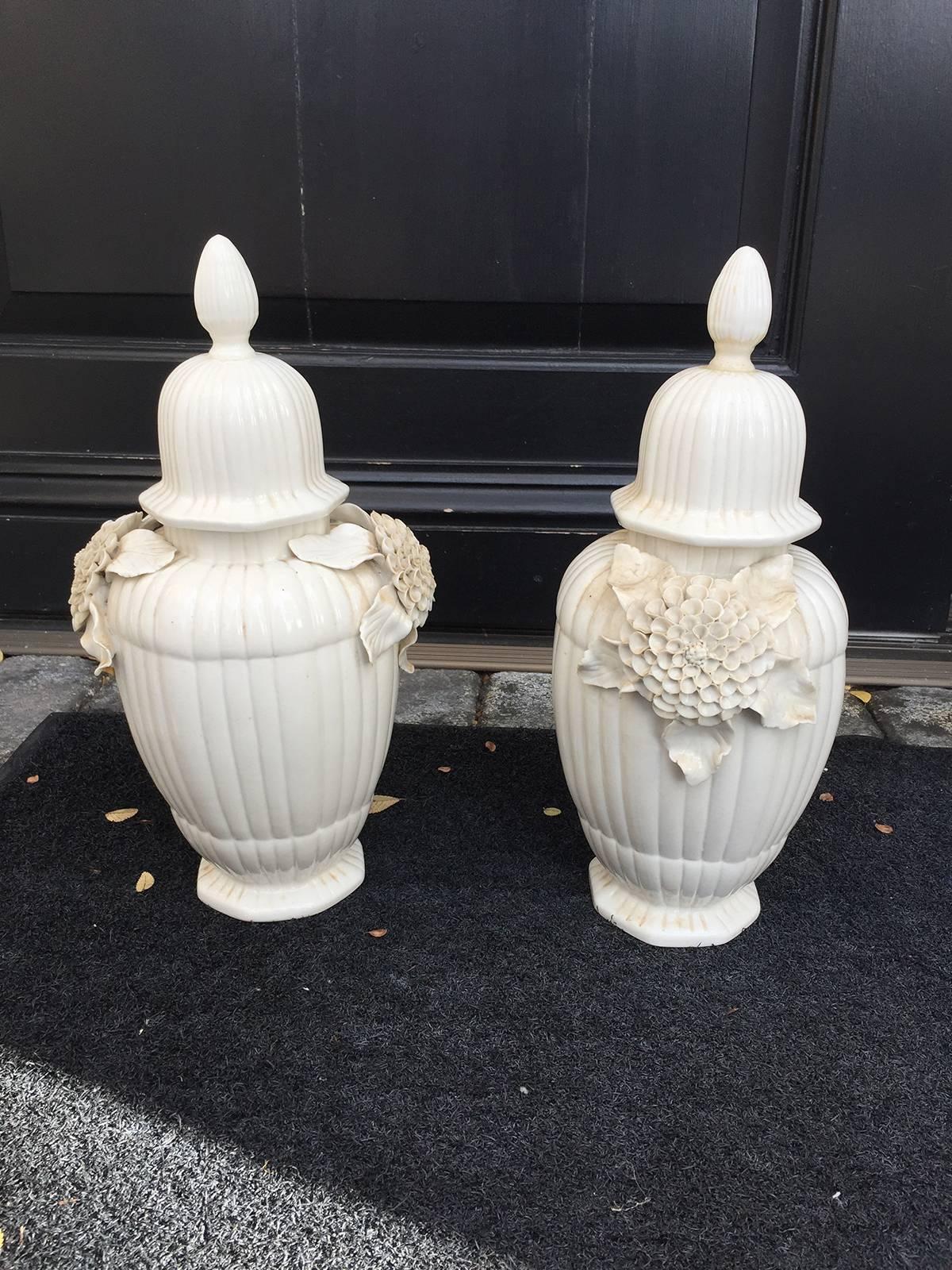 Pair of early 20th century Italian glazed floral covered jars.