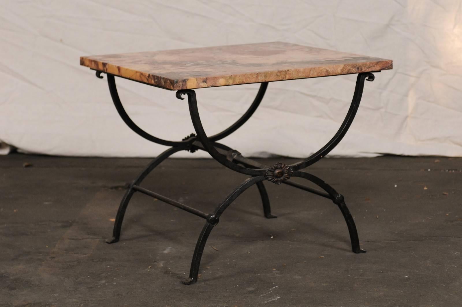 Early 20th century iron side table with marble top.