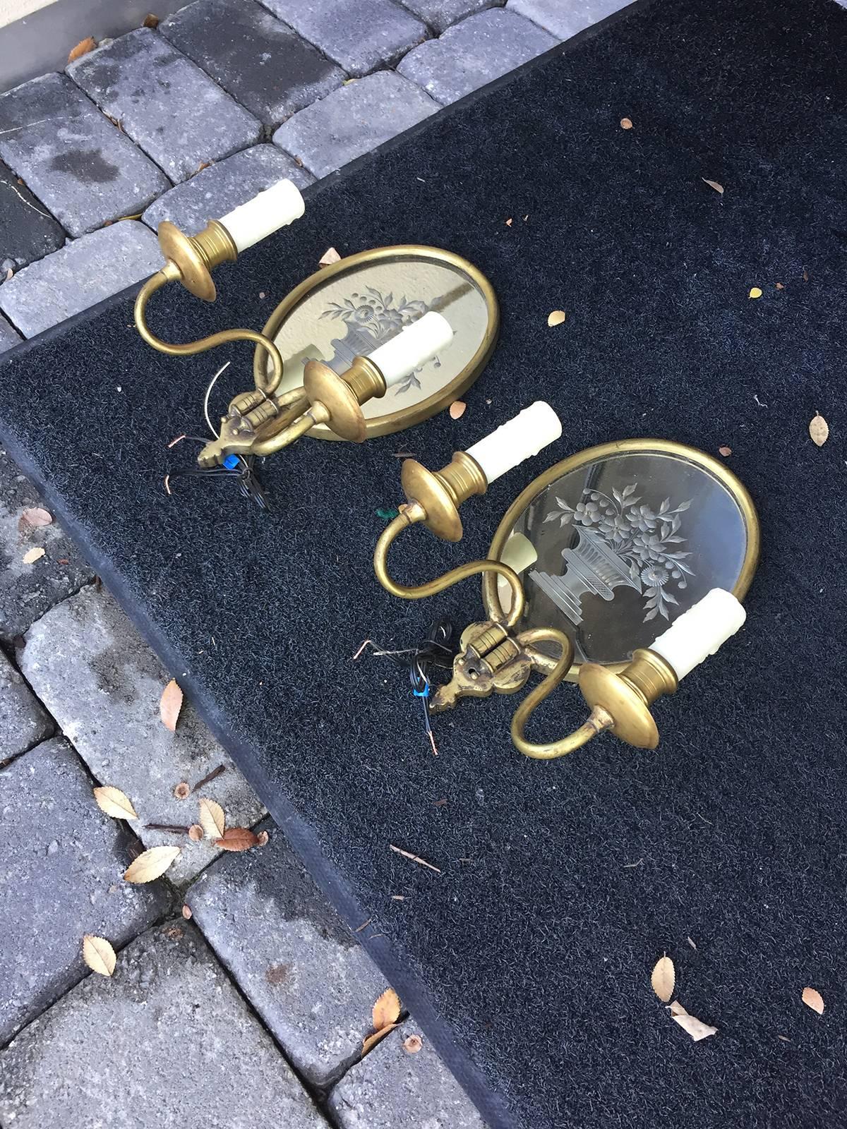 20th century pair of etched glass and brass two-light sconces.