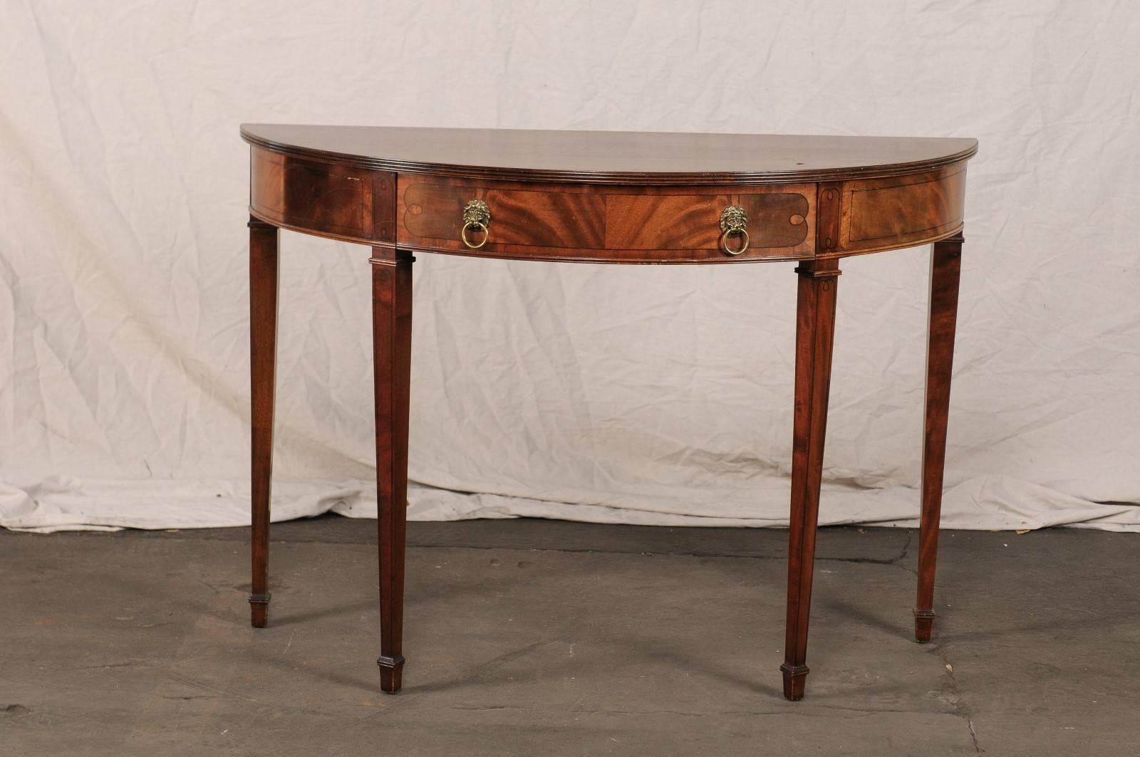 20th century American in the style of Sheraton mahogany demilune console.