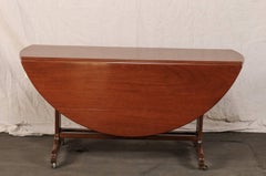 Late 19th Century Drop-Leaf Table, Trestle Form Base with Casters