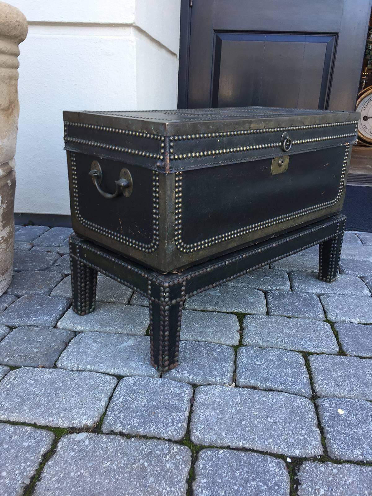 19th century English black leather trunk on stand.