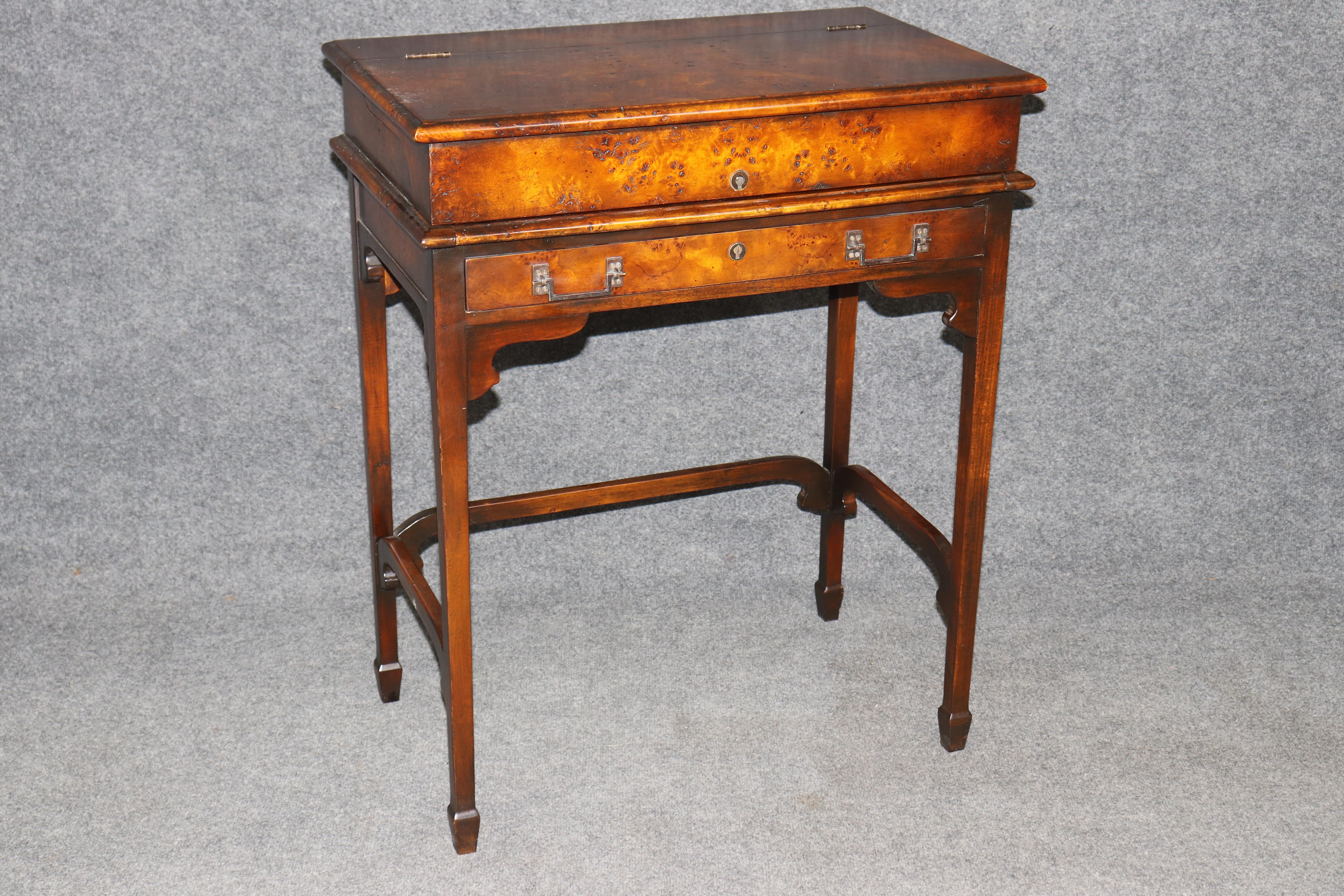 Dimensions (Closed) H: 33 1/2 in W: 27 1/2 in D: 17 in 
Dimensions (Open) H: 45 3/4 in D: 21 1/2 in

Elevate your home or office workspace with this exceptional Theodore Alexander Campaign Style Mechanical Desk, a piece that masterfully blends