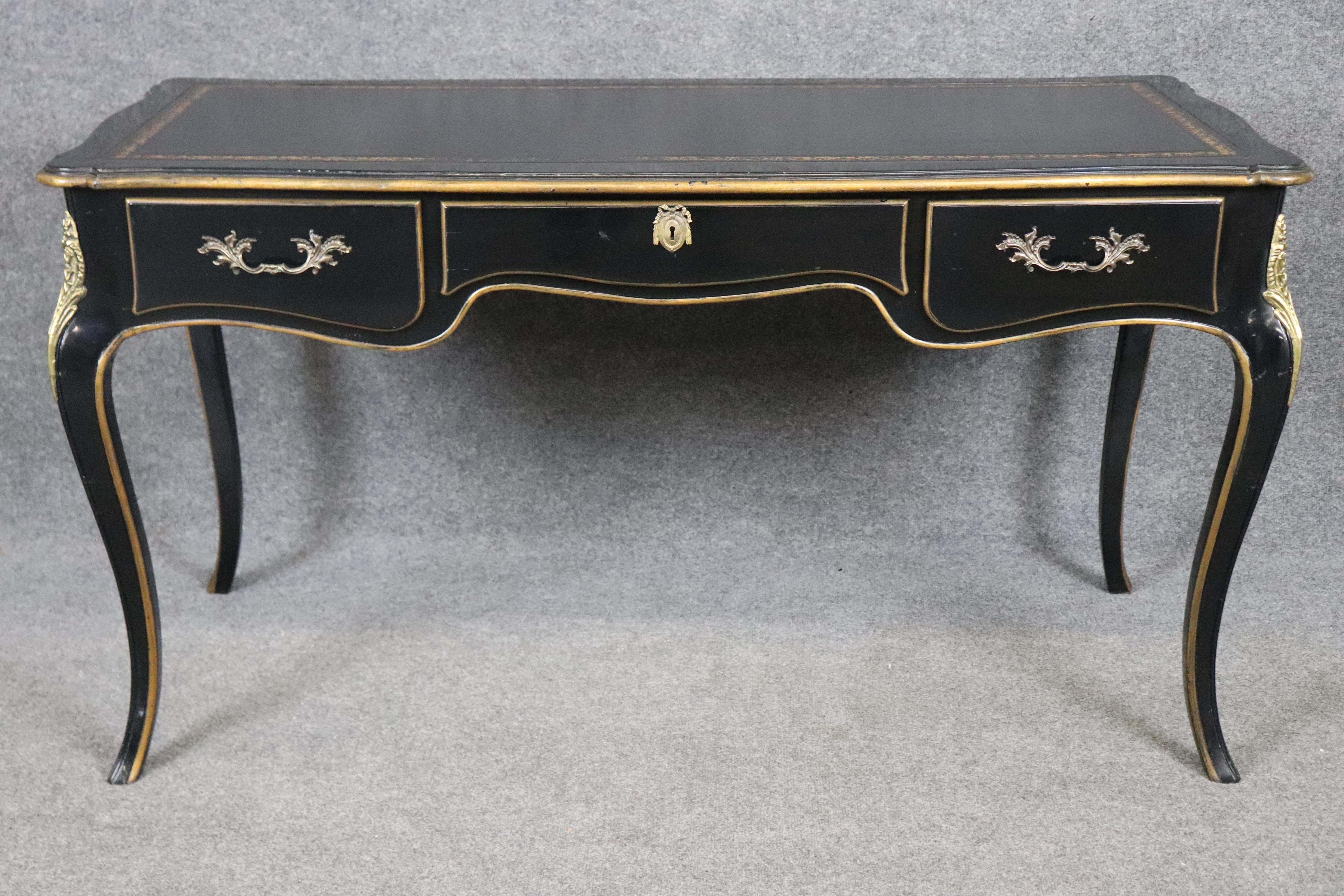Dimensions - H: 29 in W: 54 in D: 25 in 

Elevate your interior with this exceptional Louis XV style writing desk by Baker Furniture, a piece that seamlessly combines classic French elegance with the renowned craftsmanship of one of America’s most