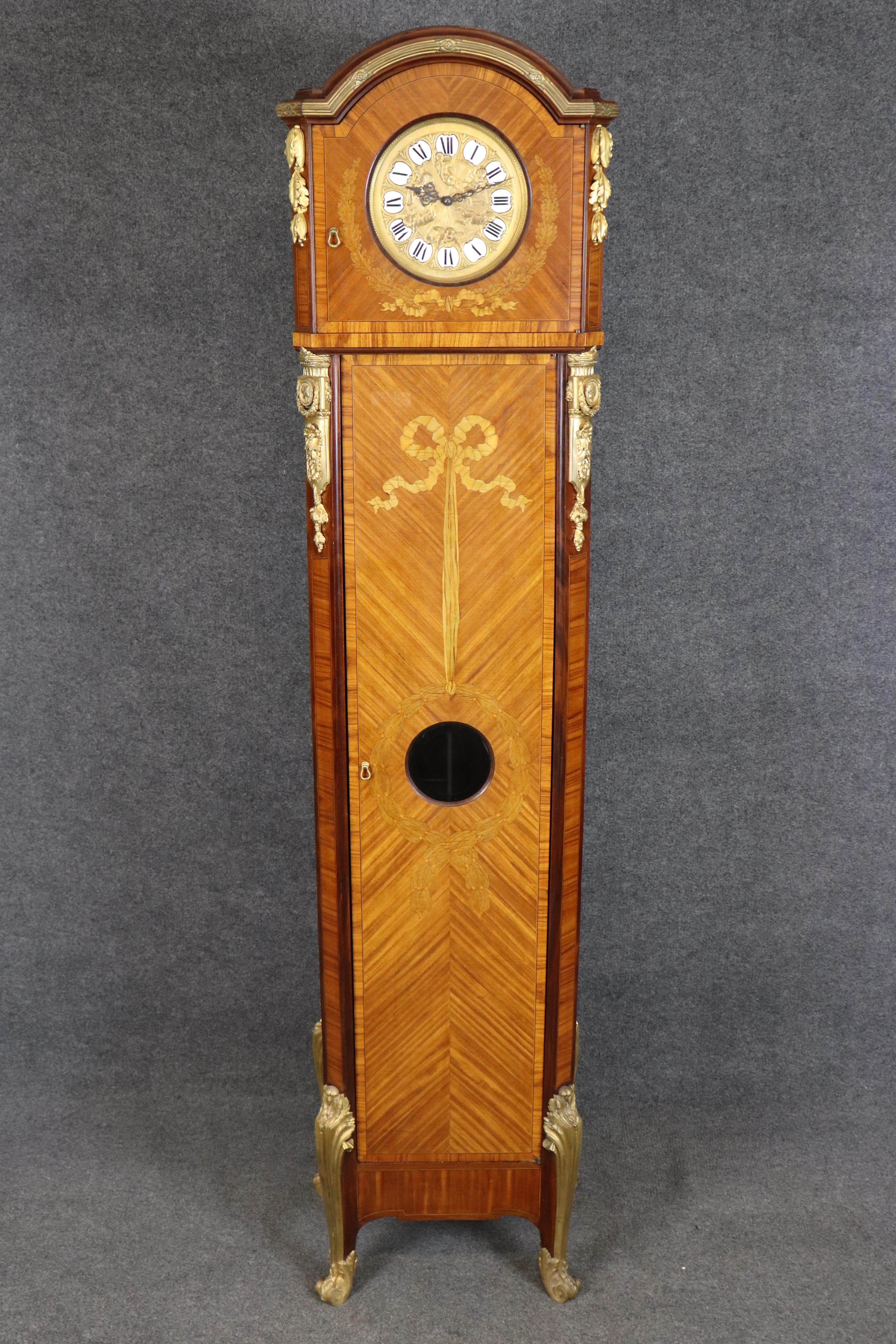 Dimensions - H: 92 1/2 in W: 24 in D: 17 in 

This magnificent French Louis XV style tall case clock represents the pinnacle of turn of the century horological artistry, executed in the distinctive manner of Joseph Emmanuel Zwiener, one of Paris's