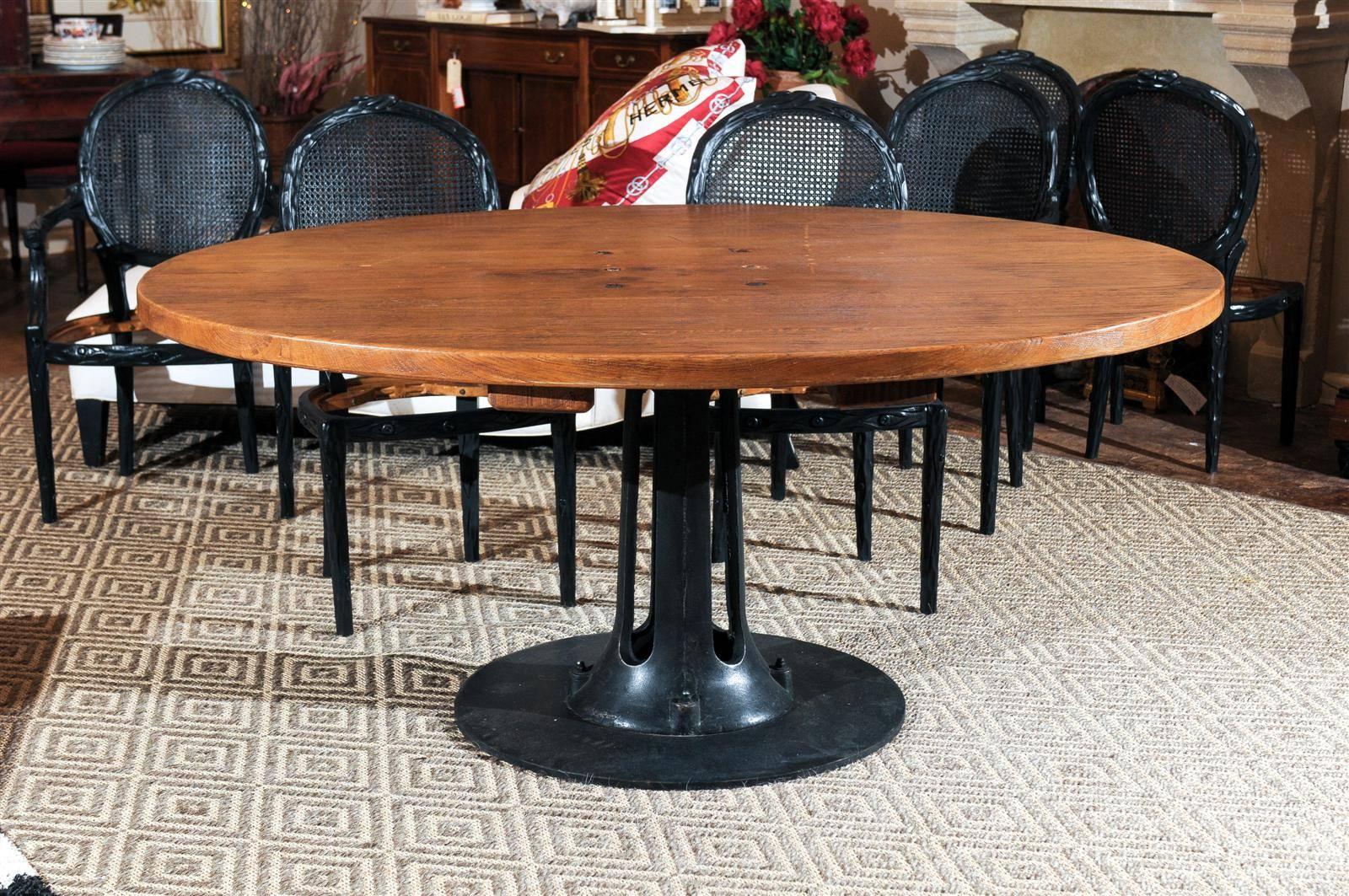 A wonderful Industrial table which would be a great dining table or many other uses. The base is cast iron with the original manufacturers plate. The 2 in. oak top is put together with bolts which can be seen in the picture. All original.