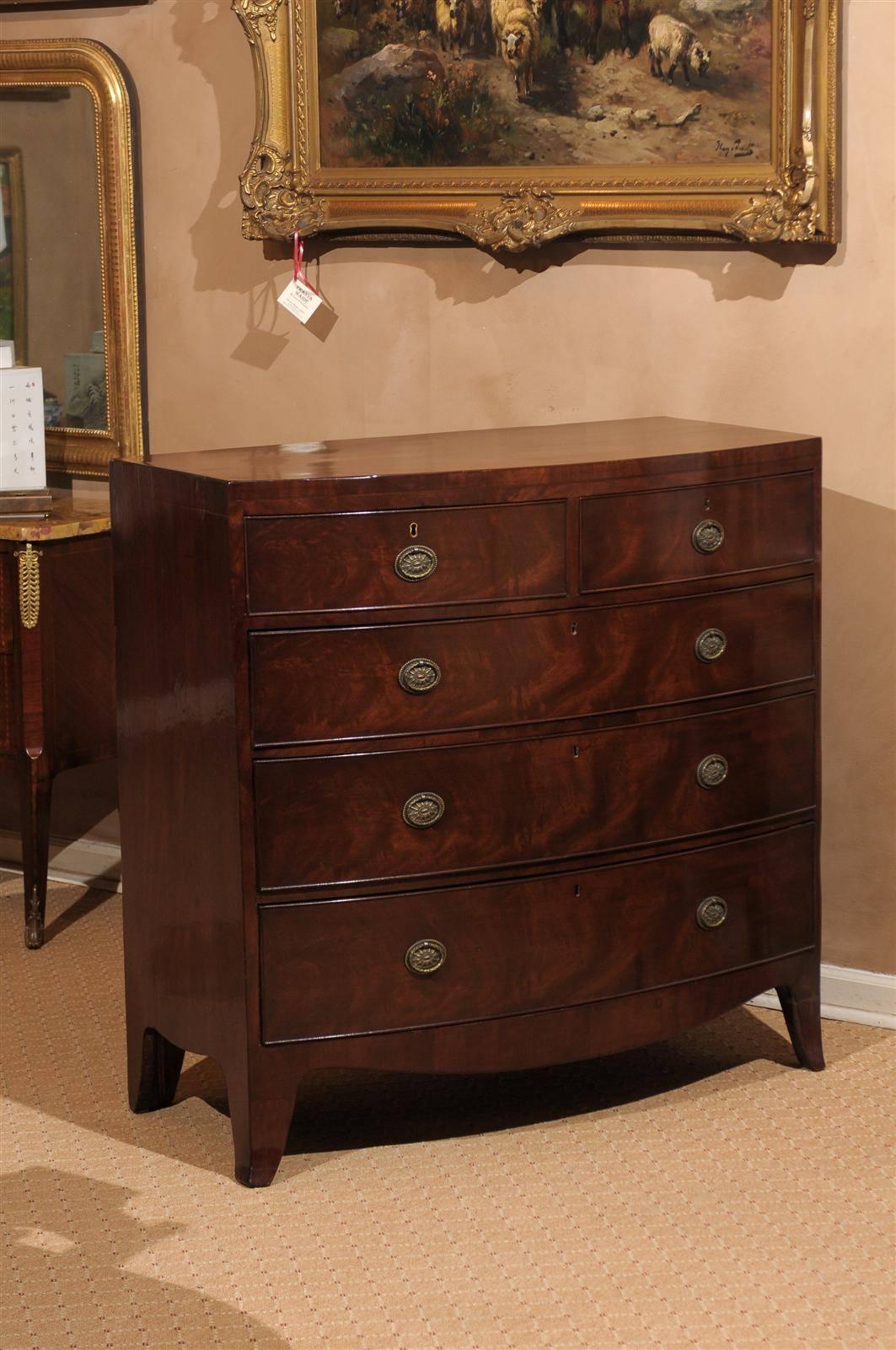 A beautiful chest, circa 1840, with two over three drawers, shaped skirt and splay feet. A lovely addition to any room in the house.