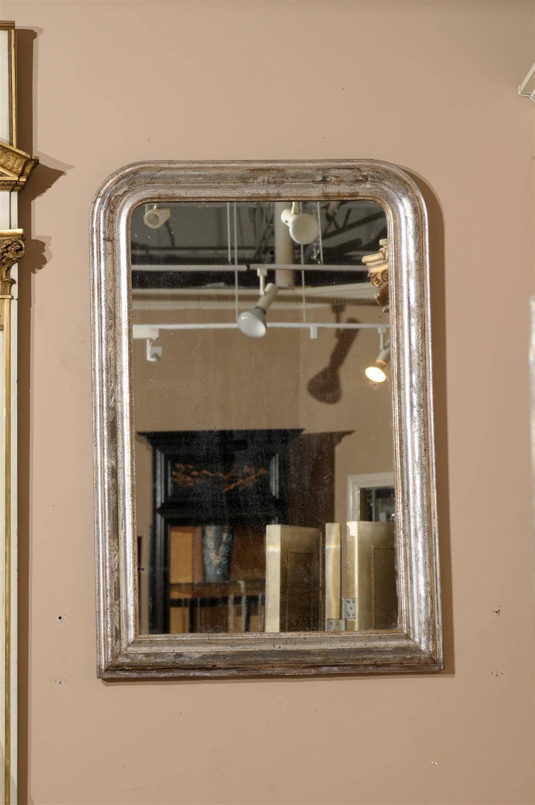 A beautiful 19th century mirror with original glass and etched leaf design on the frame.