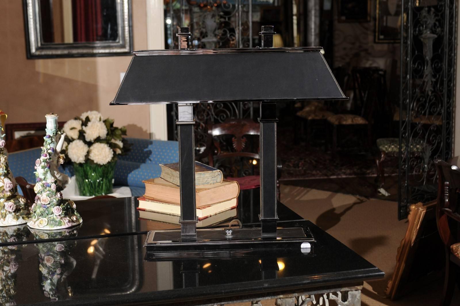 A handsome leather and chrome Ralph Lauren bankers style lamp. The black shade is 
measures 23.50 W x 10 D x 5.50 H.