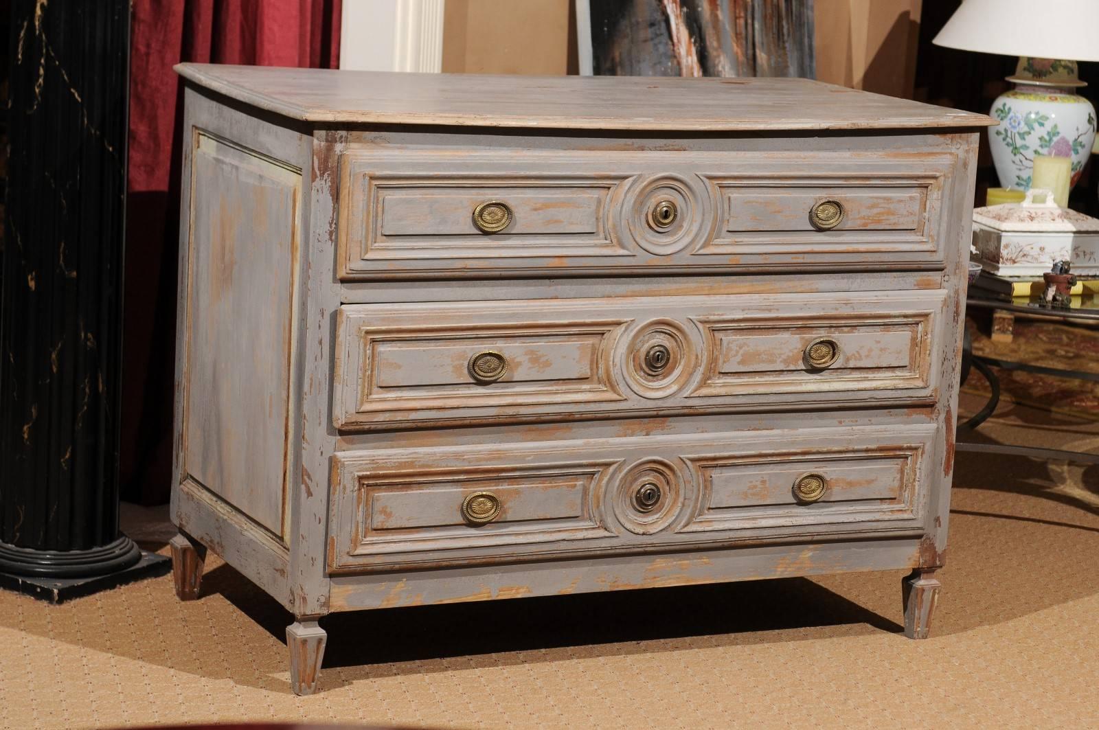 A 19th century large three-drawer, French commode in a painted finish with oval brass 
hardwear.