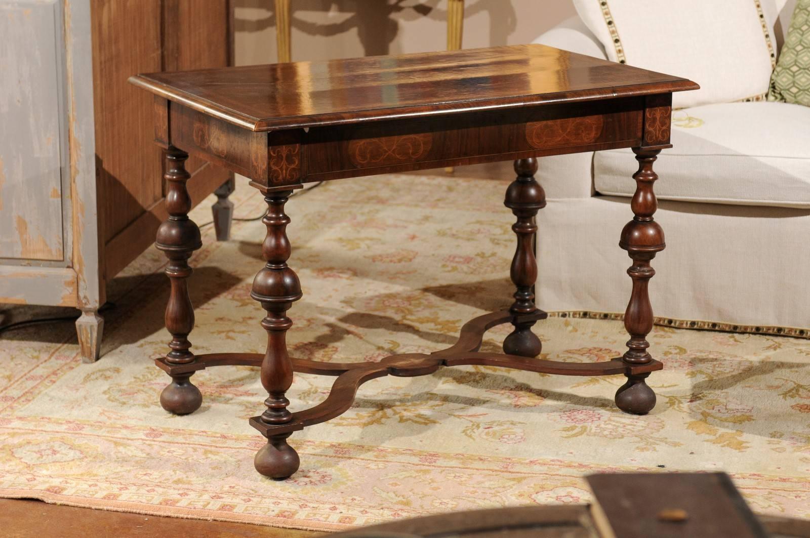 A beautiful William and Mary style marquetry inlaid walnut side or center table.
The turned legs with bun feet have an X-shaped stretcher. A very versatile piece. Lovely in any room.