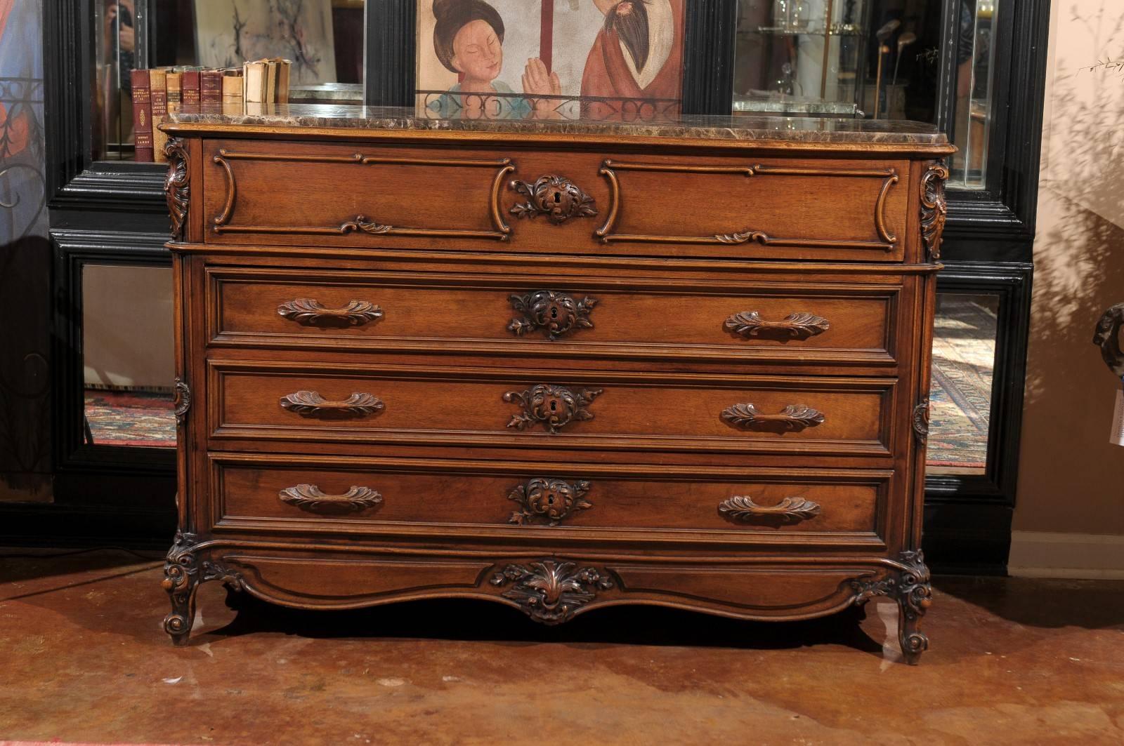 This is a beautifully carved walnut chest of drawers with marble top. The marble top is in beautiful condition in shades of brown and follows the bombe shape of the piece.
Late 19th century, this unique slight bombe chest has four drawers. The top