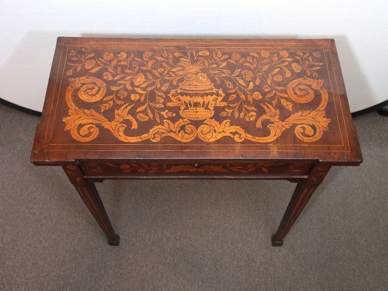 Antique Dutch marquetry fold over game table.