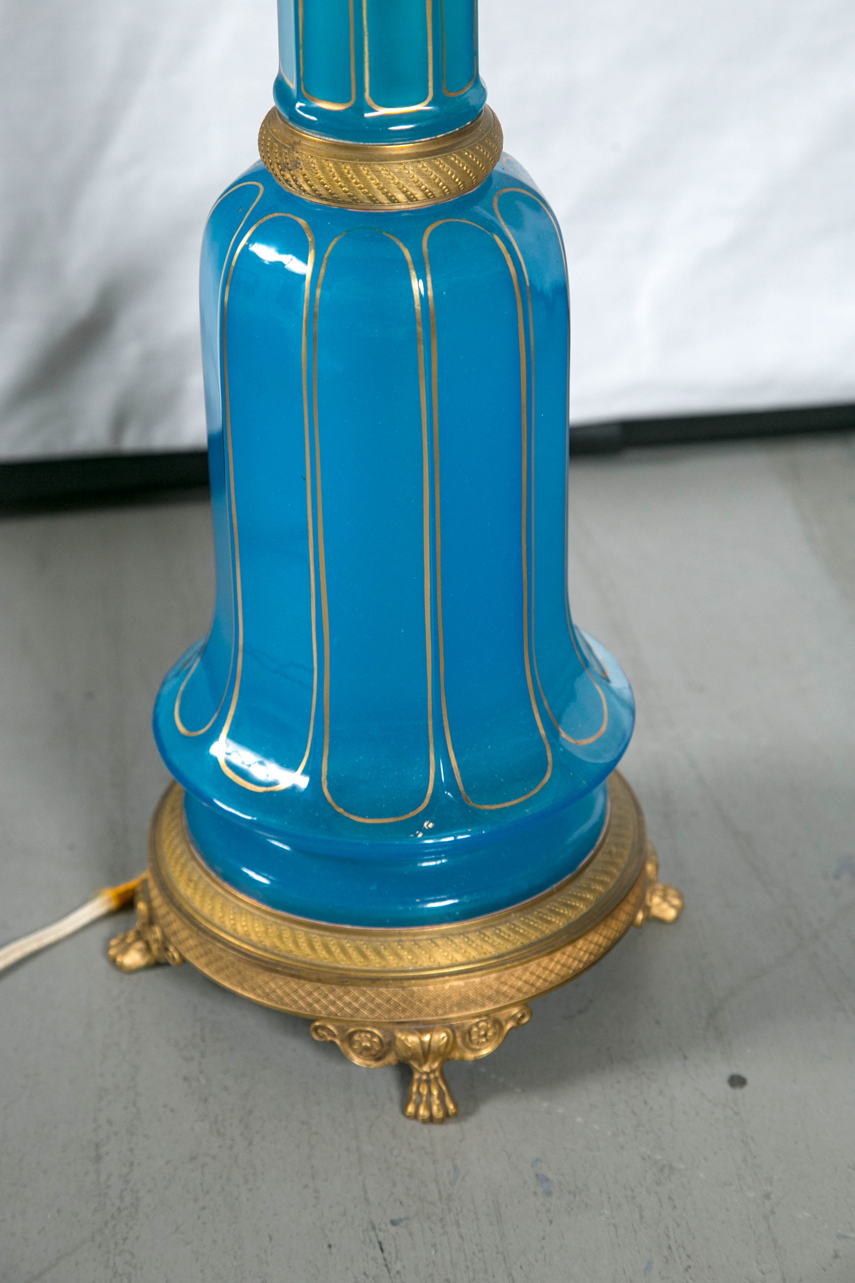 Pair of blue opaline lamps with gilt bronze trim.