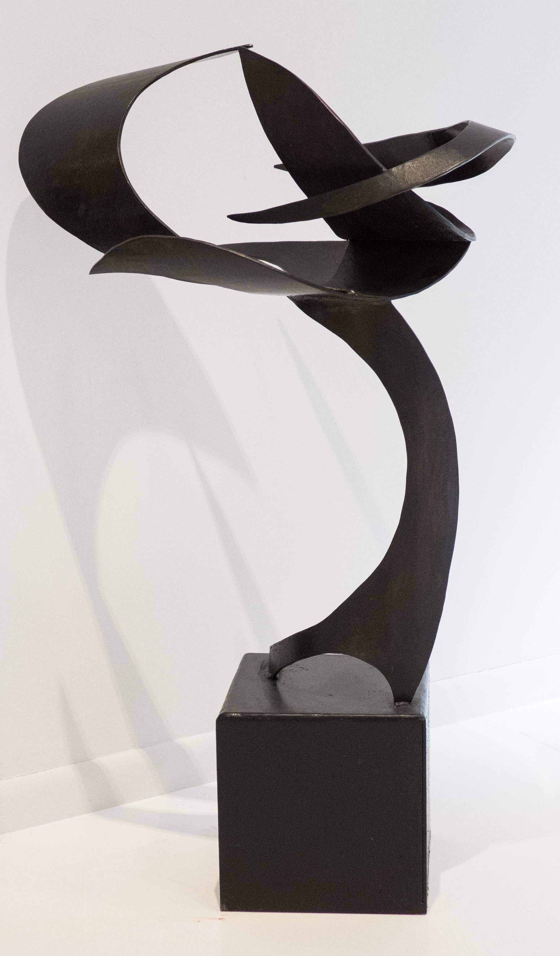 Fluidly abstract, floor-standing sculpture of patinated steel, perched on attached cubic steel base. Titled 