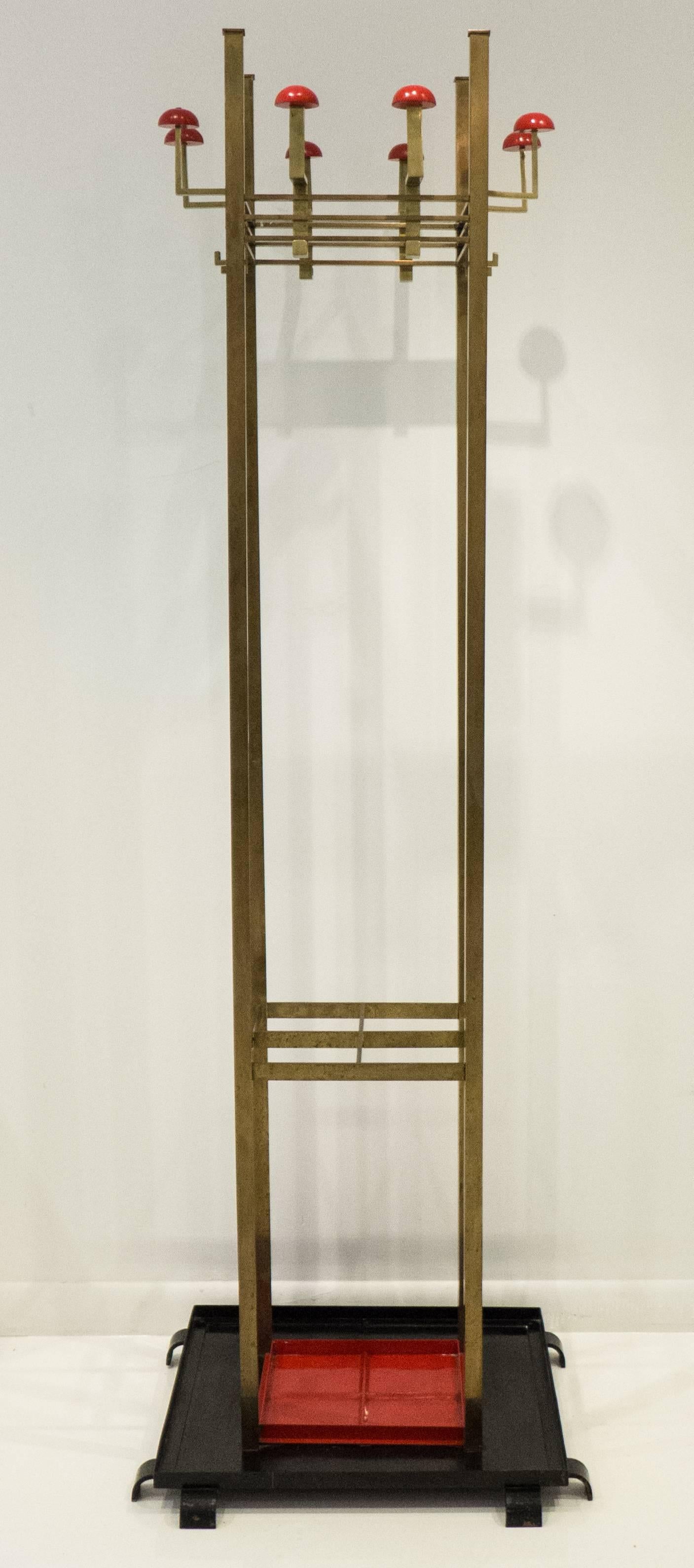Tall Secessionist coat stand or hall organizer of brass, painted steel, and painted wood. Produced by S.A. Loevy in Berlin, circa 1915. S.A. Loevy was founded in 1885 as a bronze foundry specializing in art casting. The company evolved to produce a