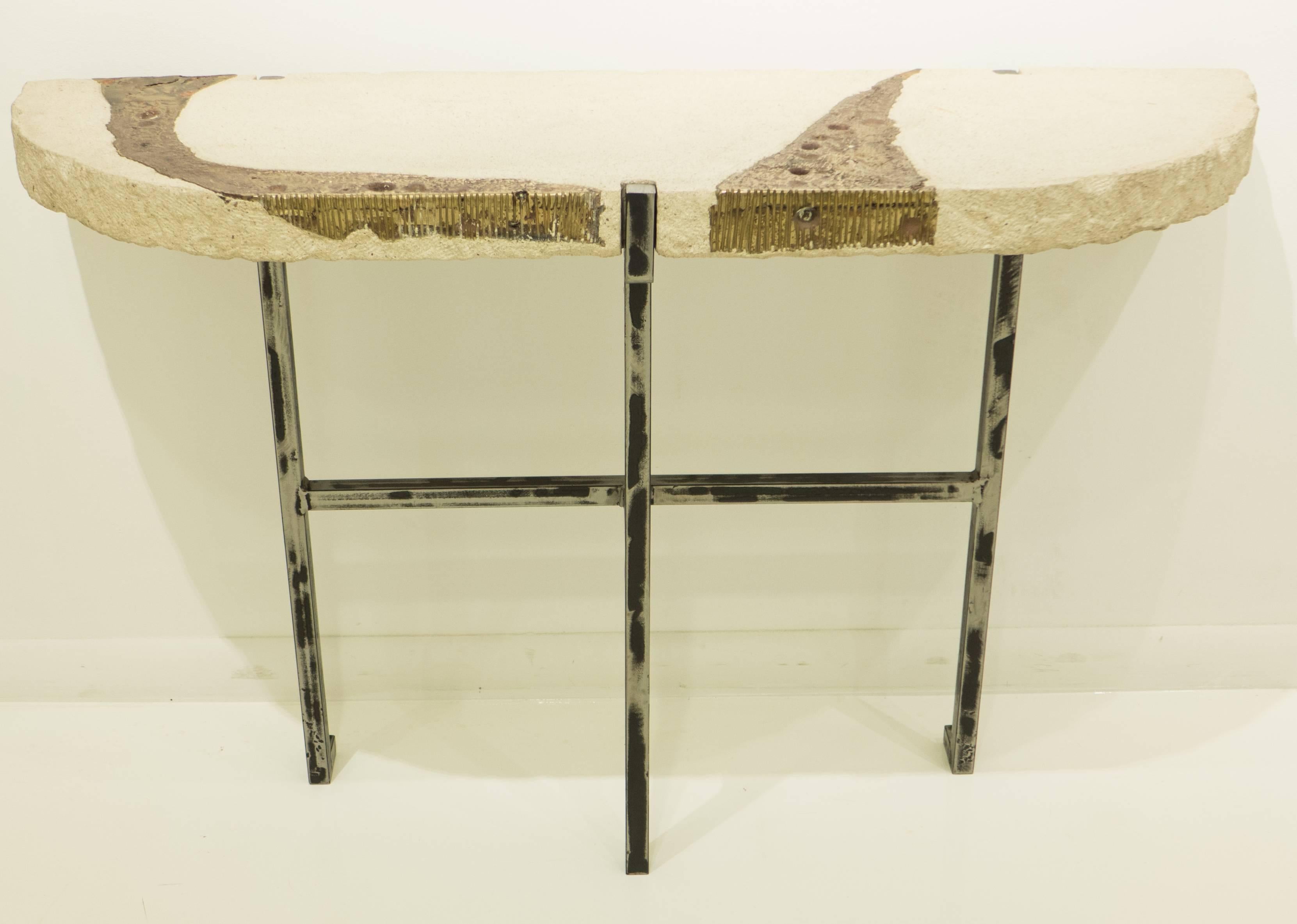 Demilune console table with a cast stone top with infused bronze, and a distressed steel base. A strong entry from Silas Seandel's 