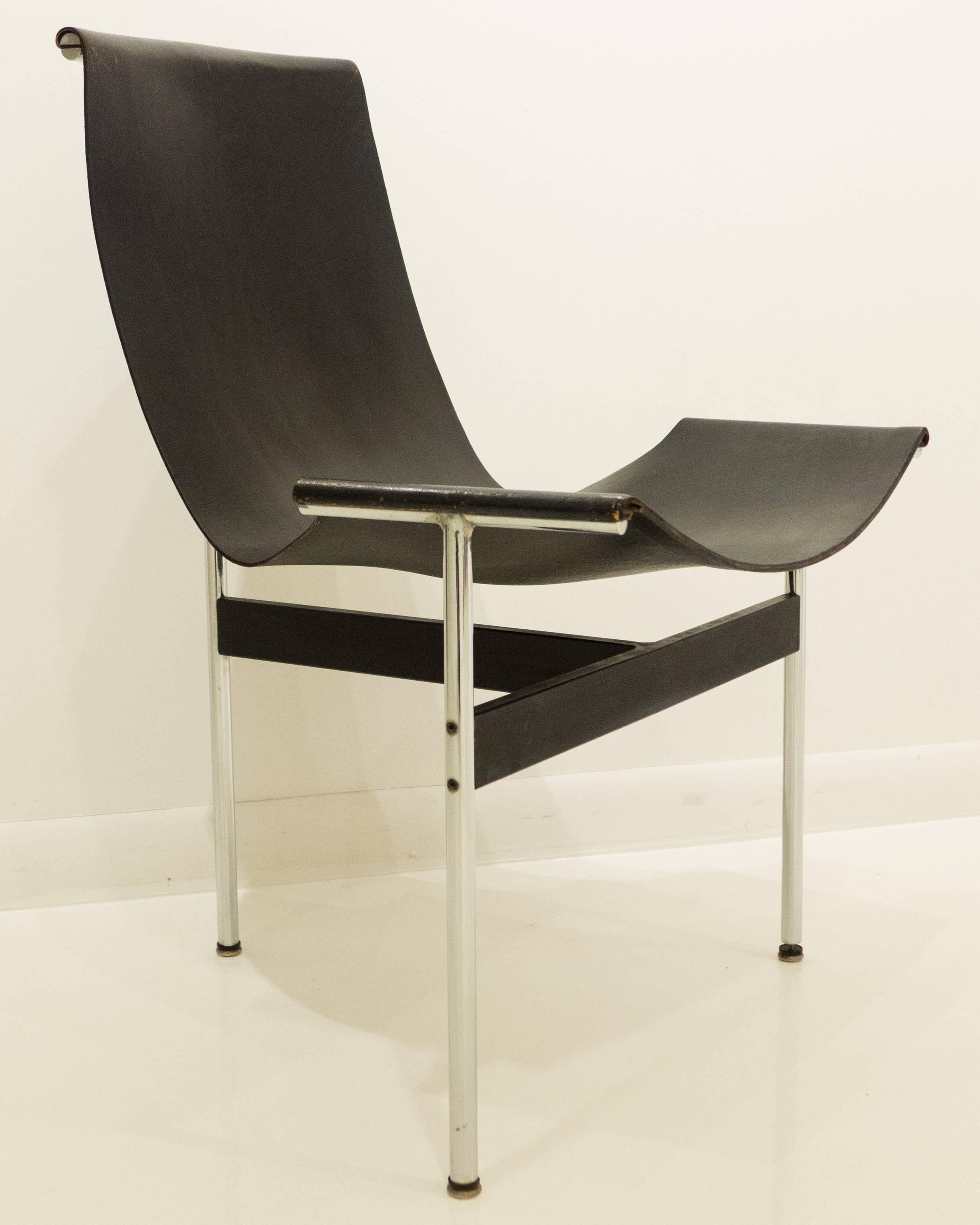 Early production T-chair in chrome-plated and enameled steel with original black leather sling, designed by Pratt alums William Katavolos, Ross Littell, and Douglas Kelley. A cornerstone of the acclaimed Laverne International 