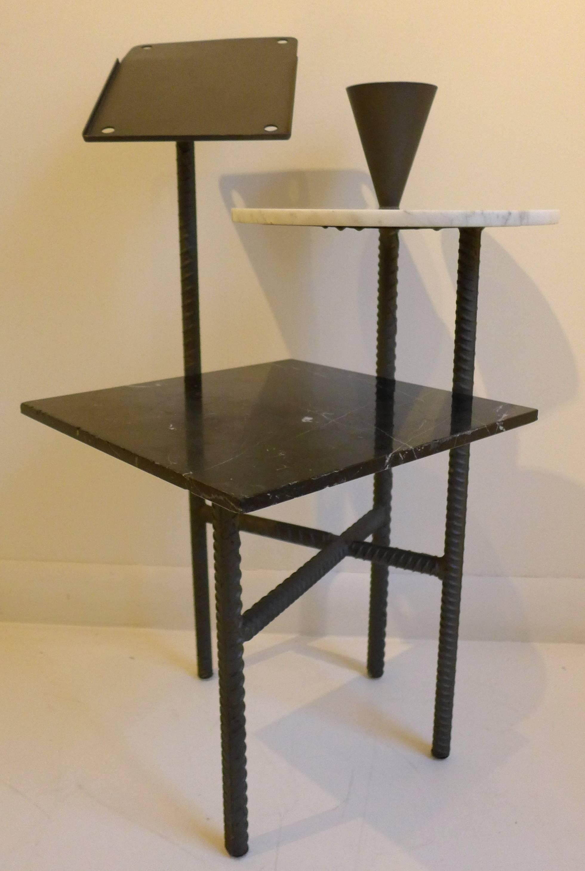 Postmodern telephone table of steel rebar, steel and Carrara marble. Designed by Philippe Starck for Ian Schrager's Paramount Hotel in New York City in 1990. The angled telephone stand can be used for an iPad or similar device, or as an easel. In