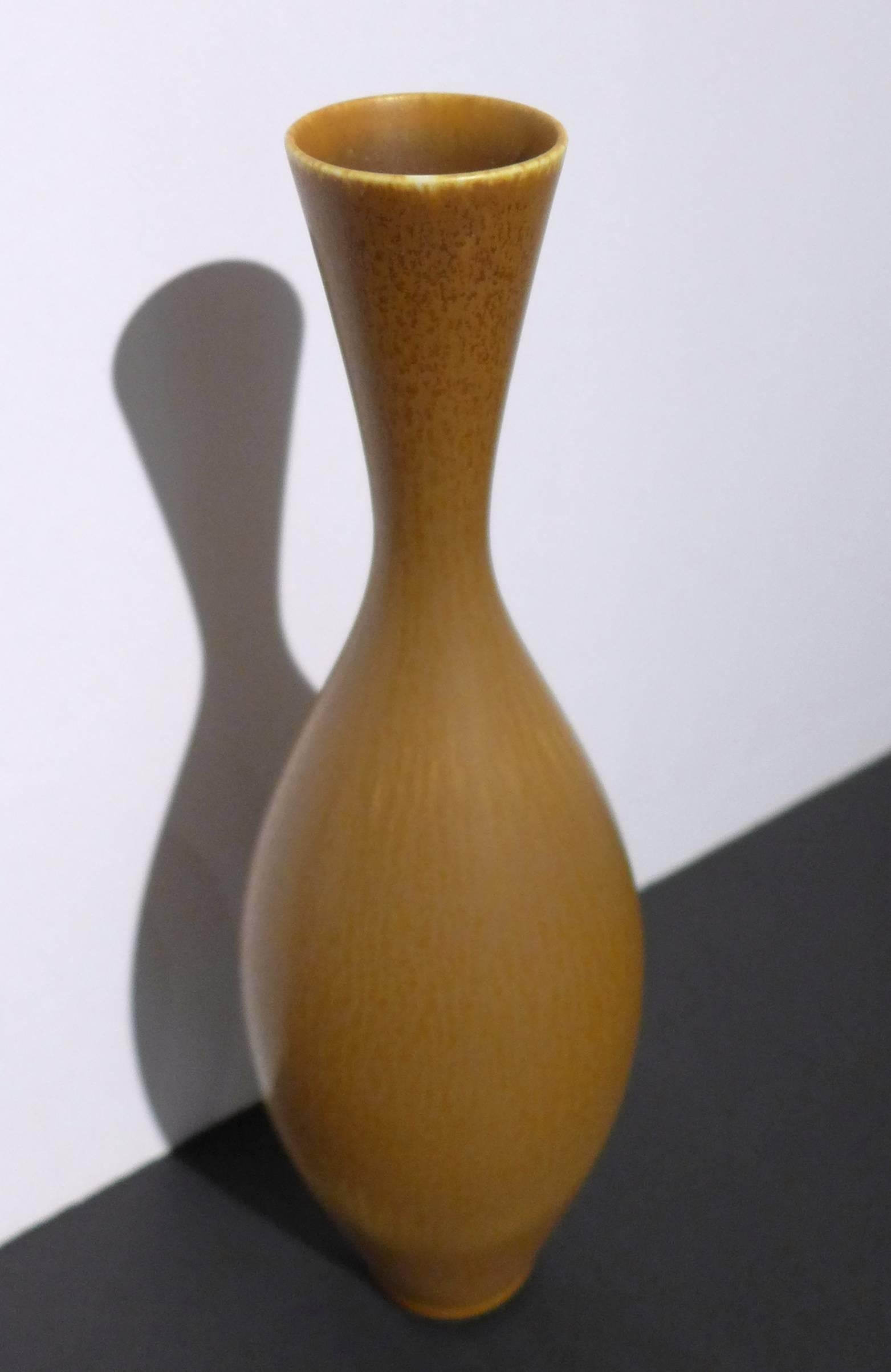 Studio stoneware vase with multi-chromatic matte hare's fur glaze in a brown/ochre color. By eminent Swedish ceramist Berndt Friberg, executed at Gustavsberg in 1958. Incised marks.