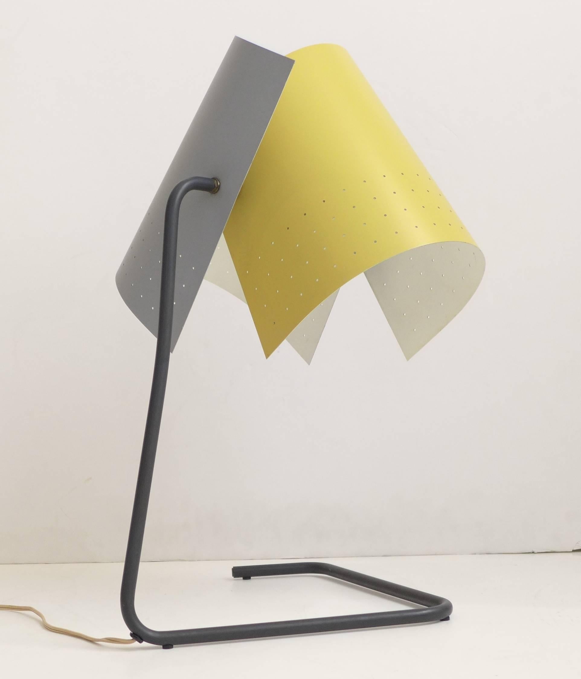 Adjustable table lamp, model T-5-G, with perforated and enameled metal shades and a bent tubular metal base designed by architect Lester Geis. An Honorable Mention selection at the famed 1951 MoMA Low-Cost Lighting Competition. Produced in very