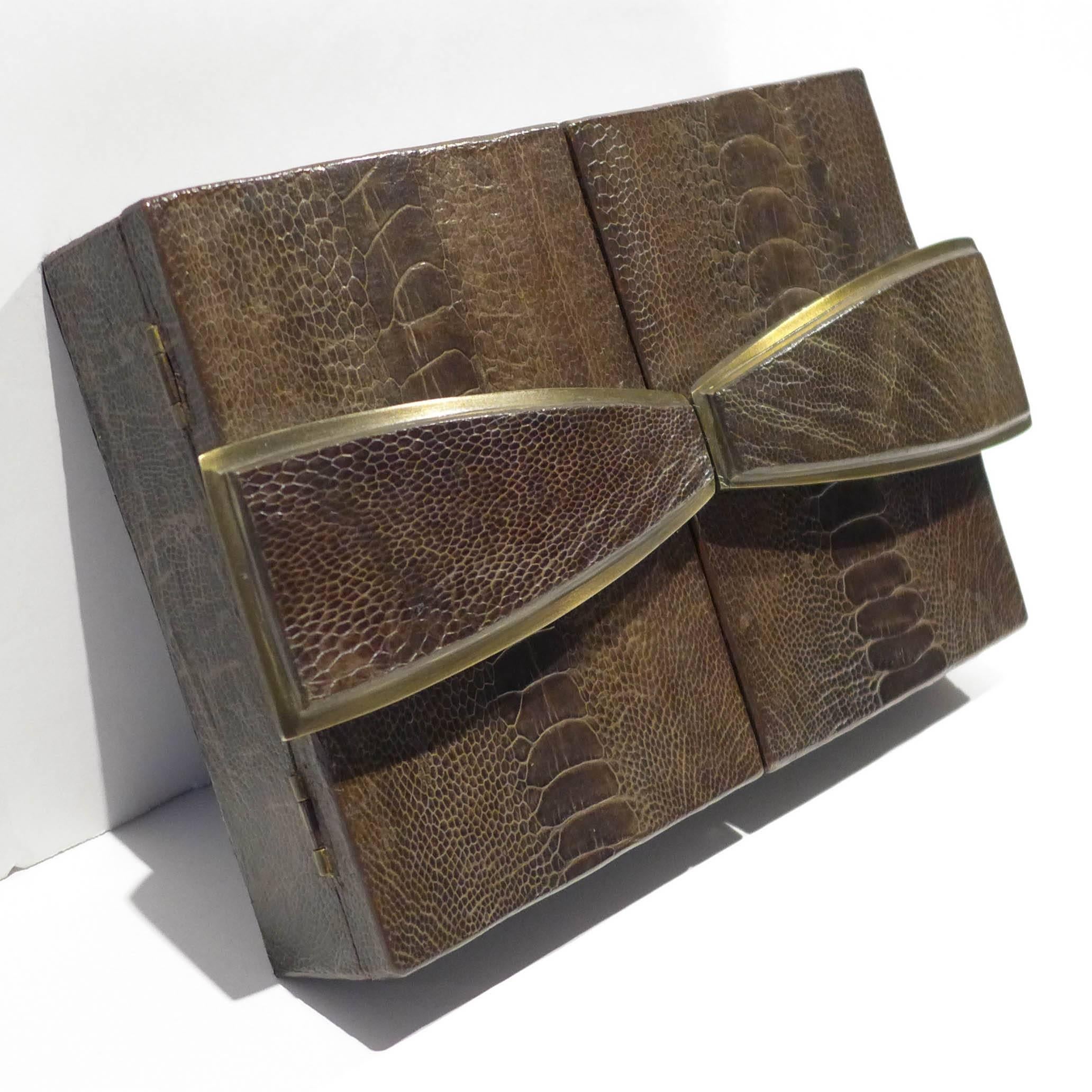 Handmade jewelry box in an Art Deco style, of ostrich leather and brass with wooden interior. A luxurious production by Ria and Yiouri Augousti, circa 1990s, stamped mark underneath.