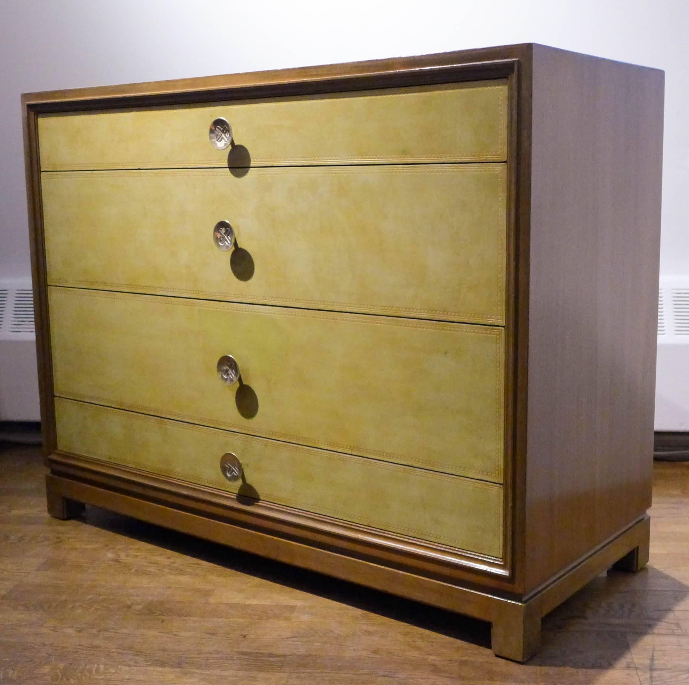 Luxe chest of drawers with bleached mahogany frame, brass pulls, and tooled leather fronts. Designed by Tommi Parzinger for Charak Modern, produced, circa 1940s. The leather is in original condition, the mahogany case has been lightly refurbished.