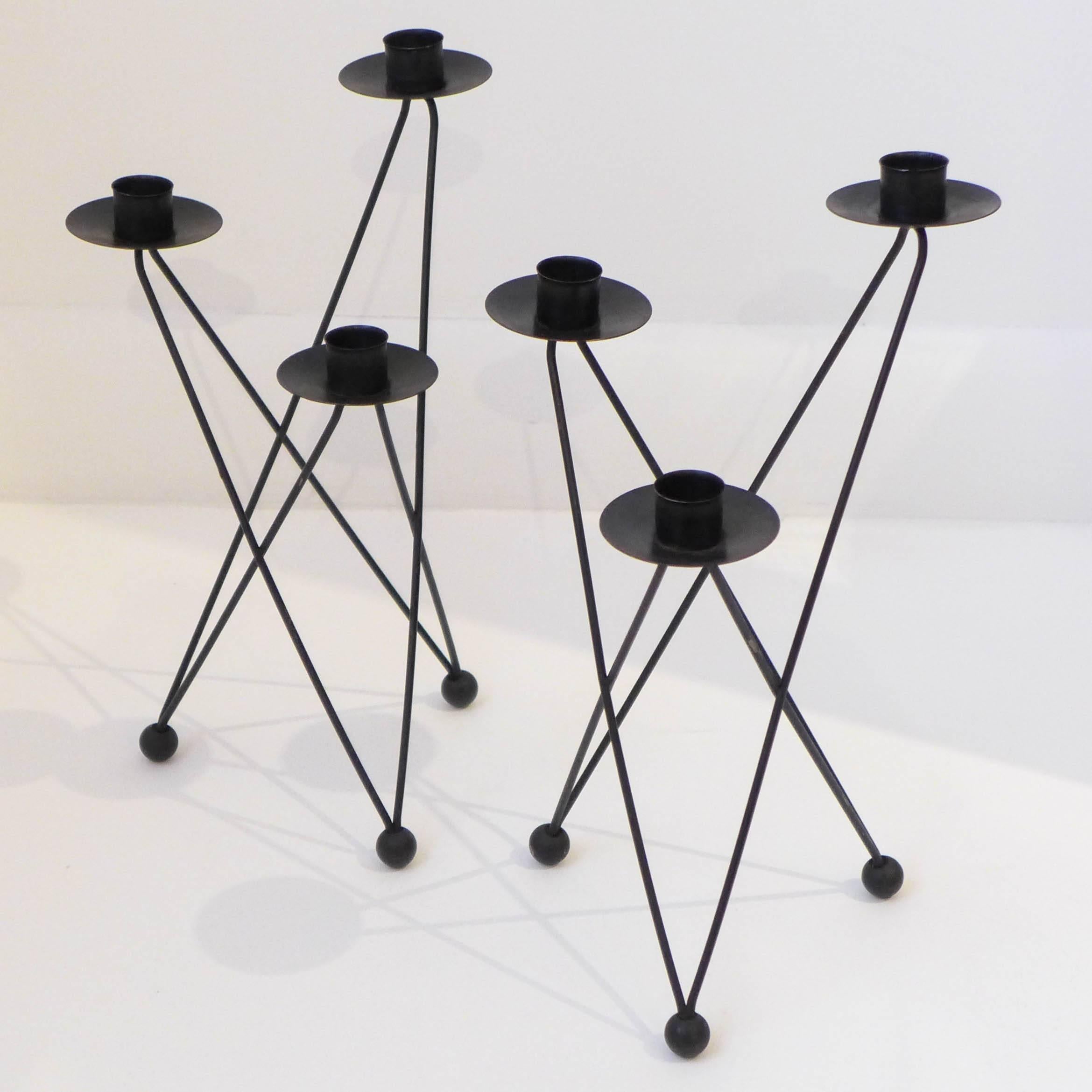 Pair of sculptural iron candelabra with a fretwork configuration akin to an Eames base, by Jordanian-American architect Victor Bisharat, made, circa 1952 while Bisharat was residing in Berkeley, CA. Bisharat moved in 1960 to the east coast and