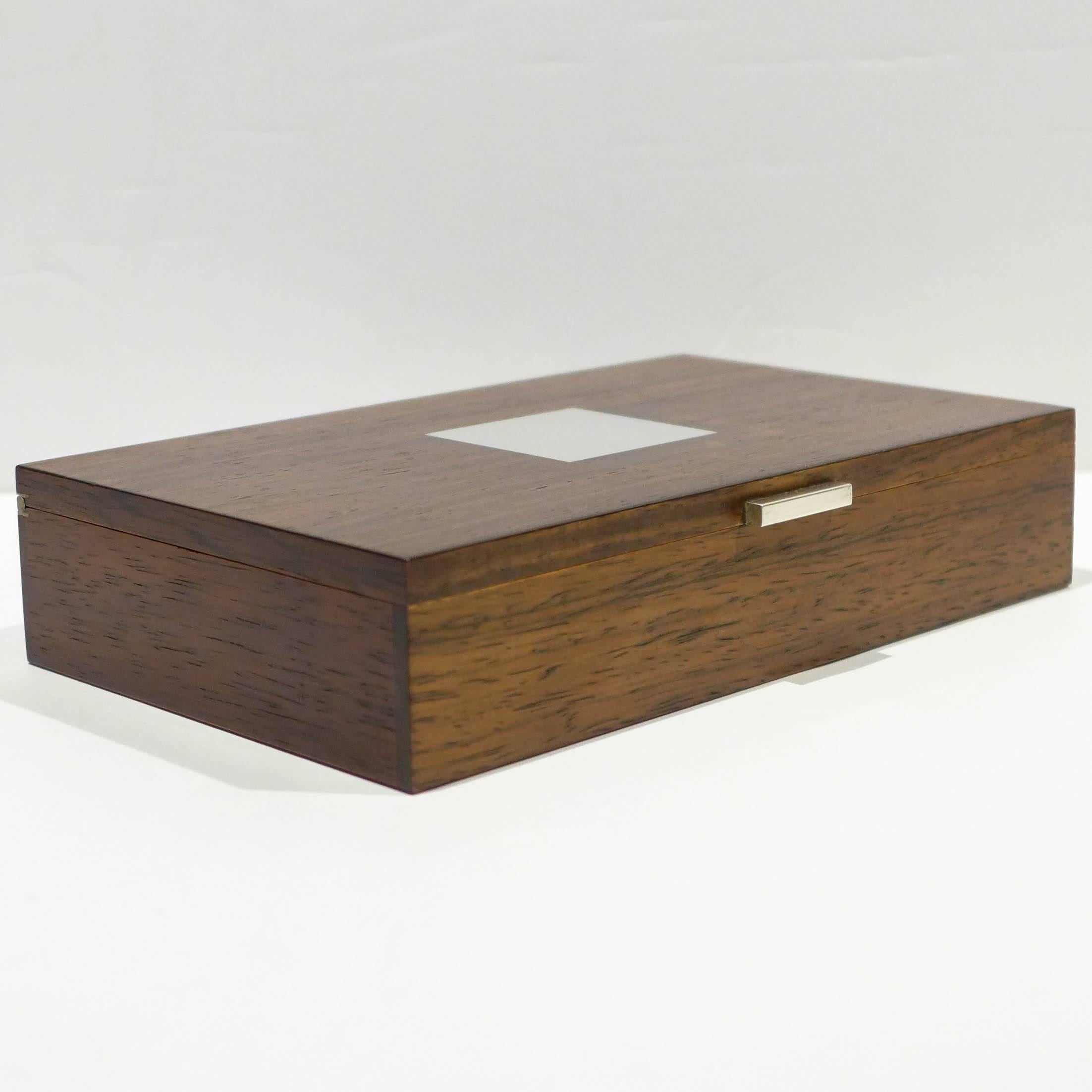 Finely crafted rosewood box with sterling silver inlay and segmented interior by Danish silversmiths Hans Hansen. With silver hallmark underneath.