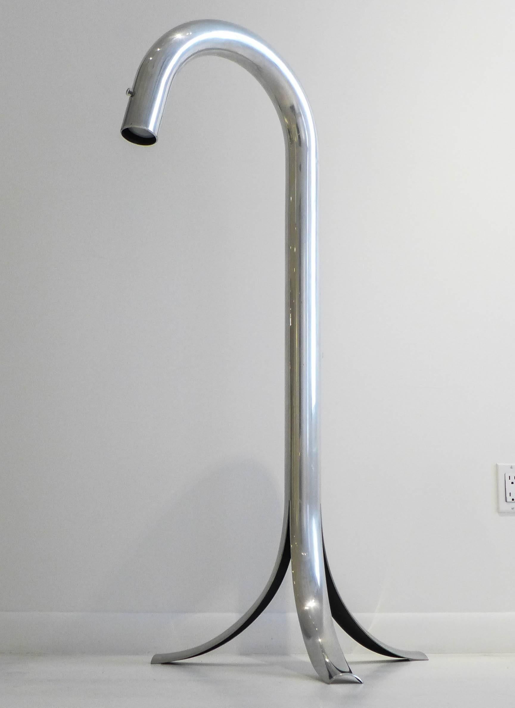 Tube floor lamp of polished aluminum with a cleverly split tripod base and original Lucite knob. A 1968 pop-era design by John Mascheroni and Tony Palladino, produced in NYC by the John Mascheroni Furniture Company, as part of the Tubo line. A rare