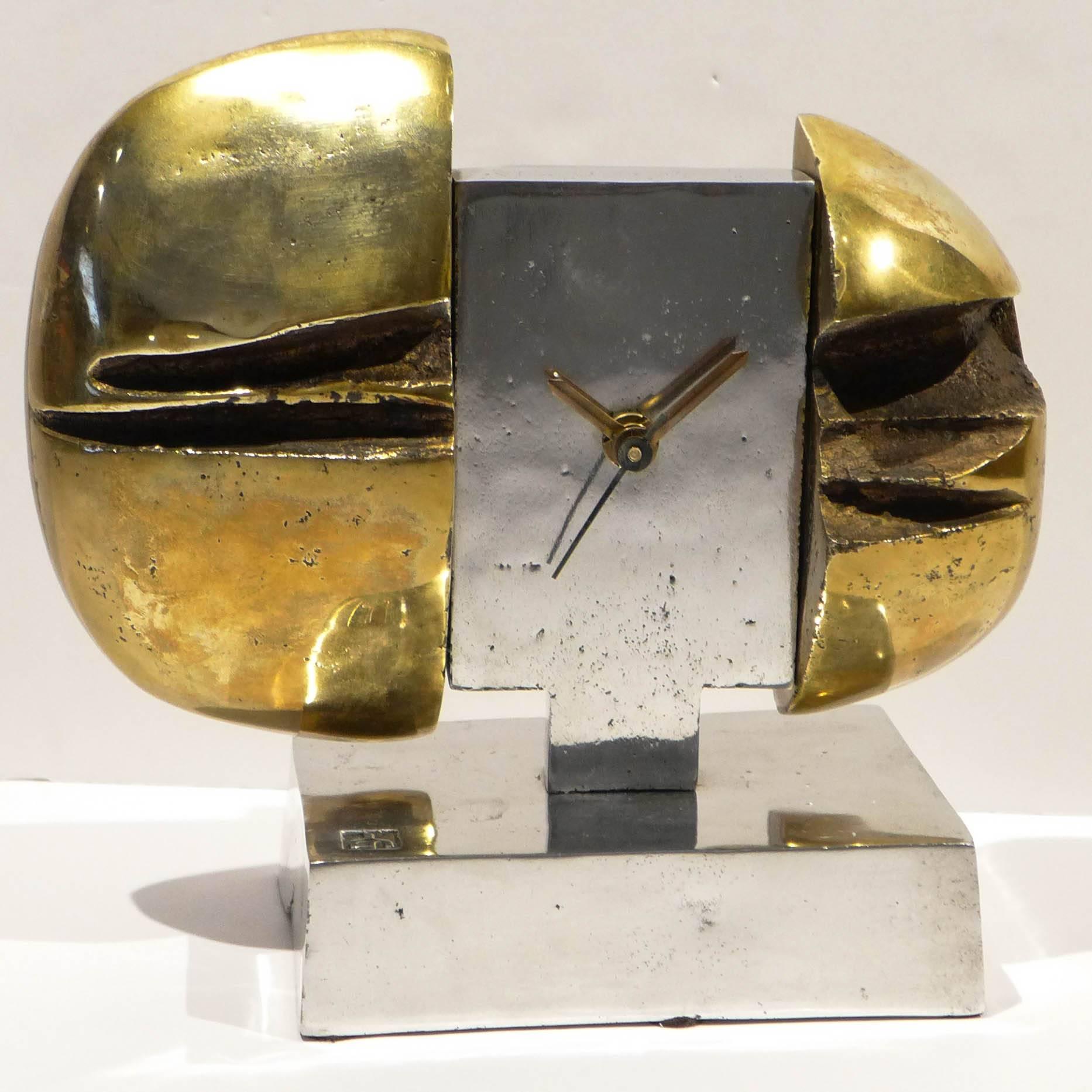 Brutalist clock of cast bronze and cast aluminum by Scottish/Spanish/American artist David Marshall (b. 1943), executed, circa 1970. Marshall settled in Spain in the mid-1960s, opening a workshop in Malaga in 1969 where he produced sculpture,