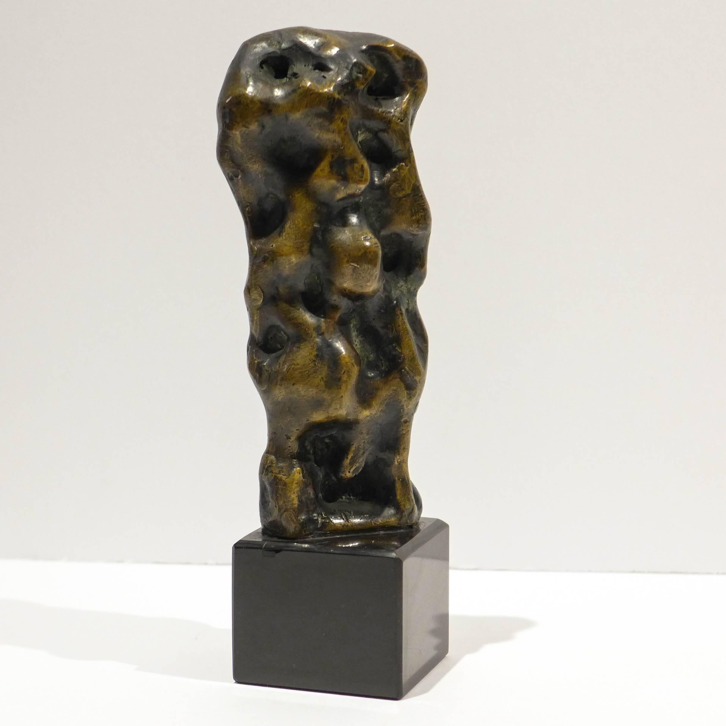 Small figural abstract cast bronze sculpture on black marble base by Chicago artist Abbott Pattison (1916-1999). After receiving his B.F.A. from Yale in 1939, and a stint in the Navy, Pattison returned to his native Chicago. From the 1950s through