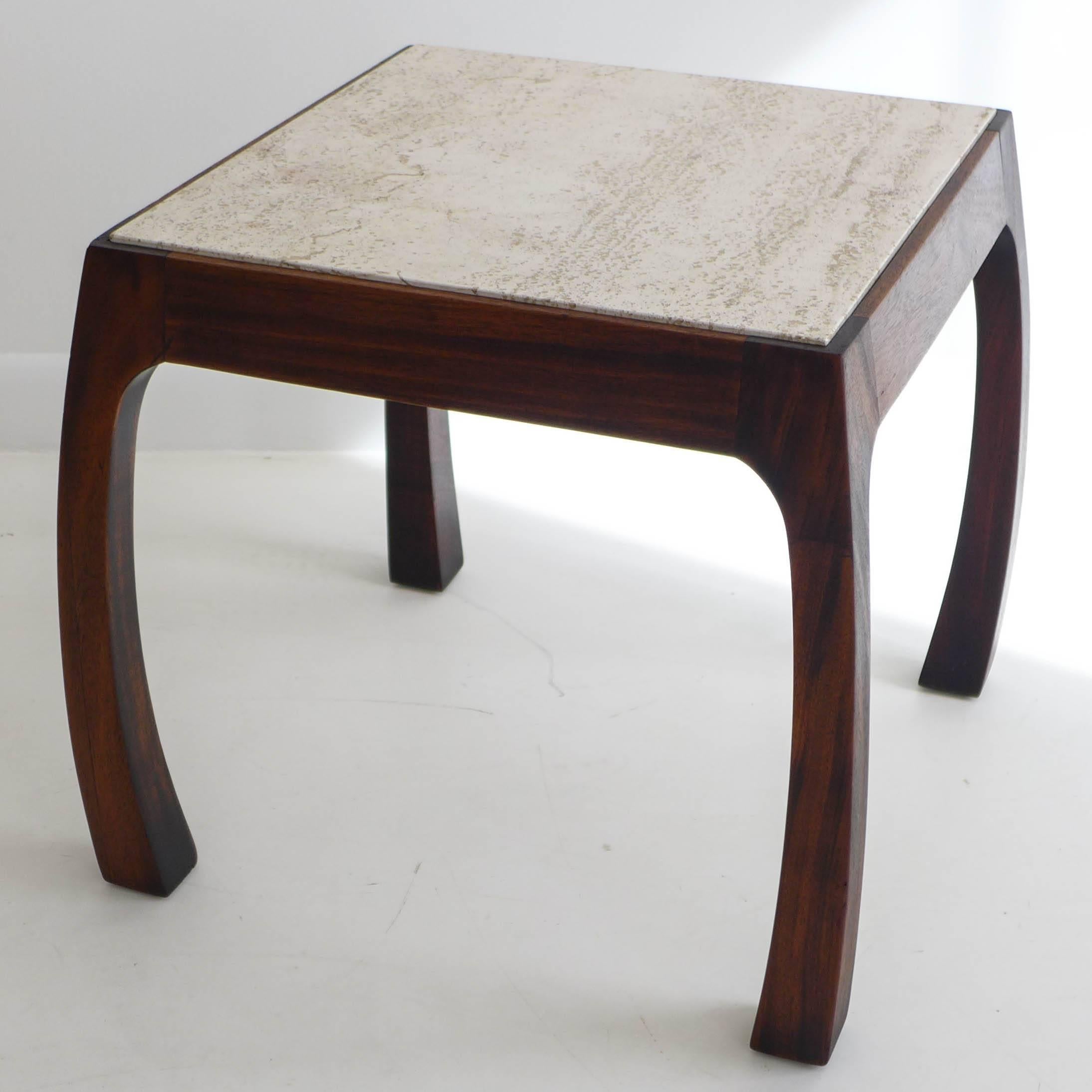 Side table with travertine marble top and a mahogany base with fluidly splayed legs. Designed and produced by Harvey Probber, circa 1958, as model number 945. Ref: Harvey Probber The Design Book. The top measures 18