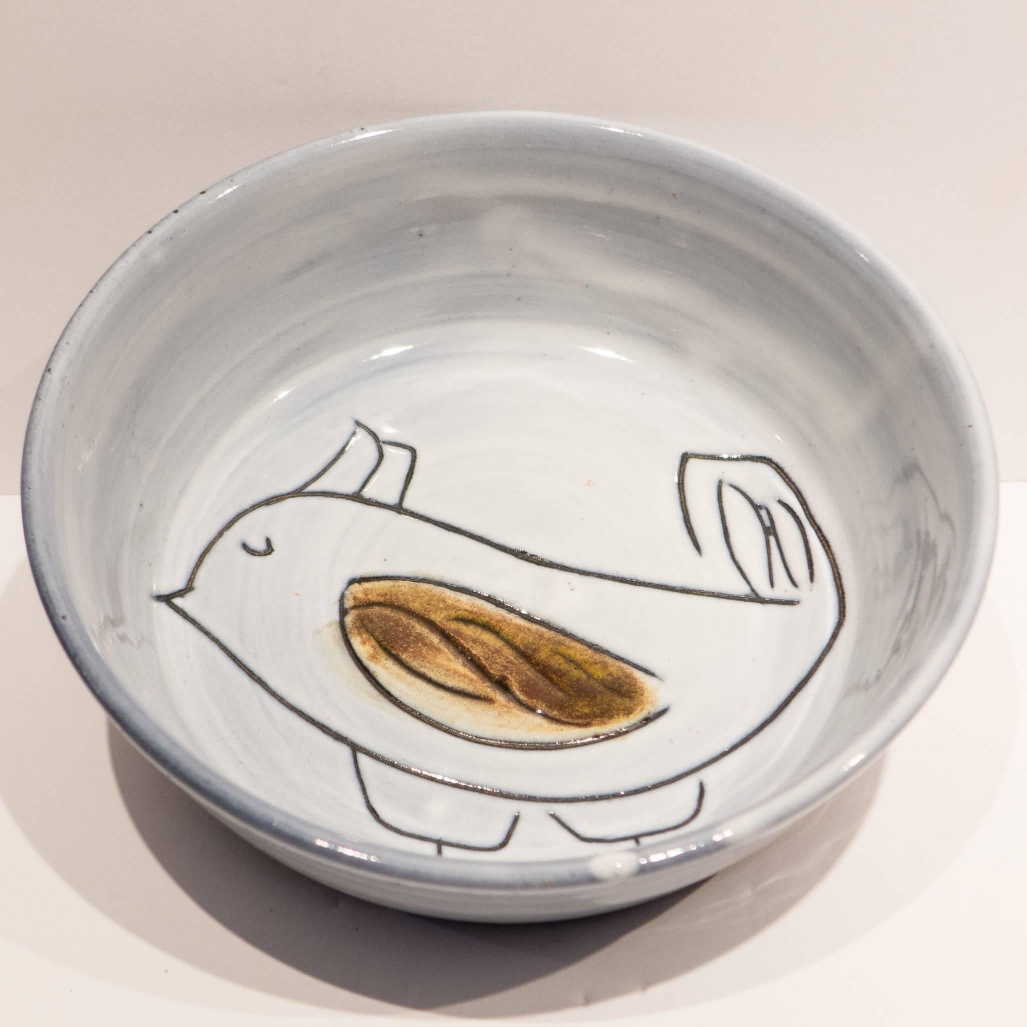 Small earthenware bowl with incised and painted abstract bird, by renowned Vallauris ceramic artist Jacques Innocenti (1926-1958). Signature to bottom.