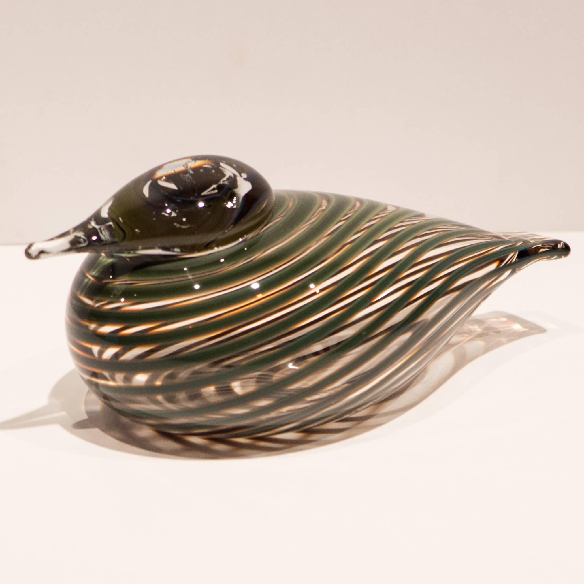 Handblown glass Whipporwill with swirling green lines in a clear matrix. By Finnish master Oiva Toikka, produced at Iittalla's Nuutajarvi Glassworks, circa 1980s. In fine original condition with no external marks, marred only by a one-inch milky